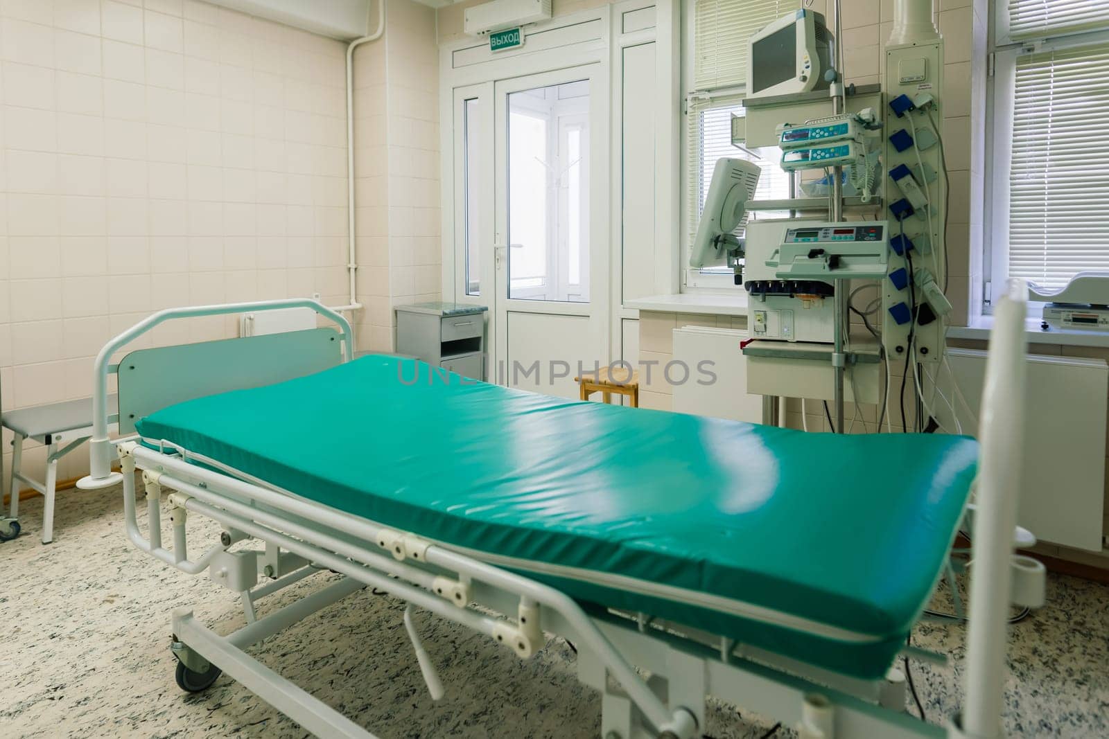 Interior of new operating room with equipment in modern clinic by Zelenin