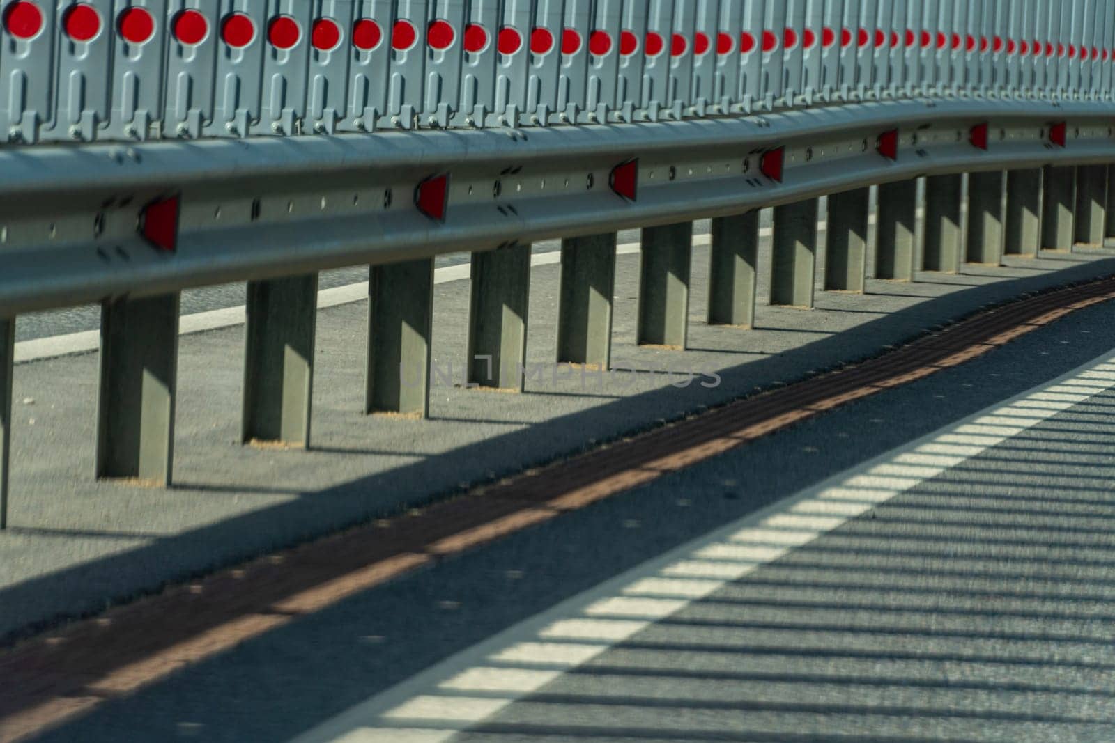Safety barriers on highway. Anodized safety steel barrier. Enhancing highway safety. by Matiunina