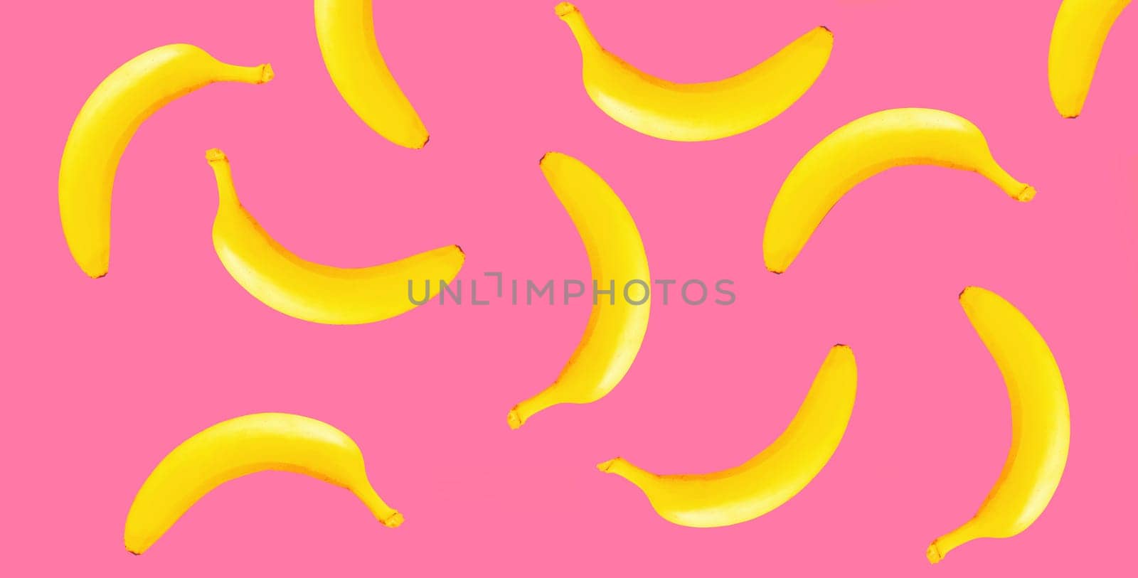 Stylish creative image yellow banana on pink background by Rohappy