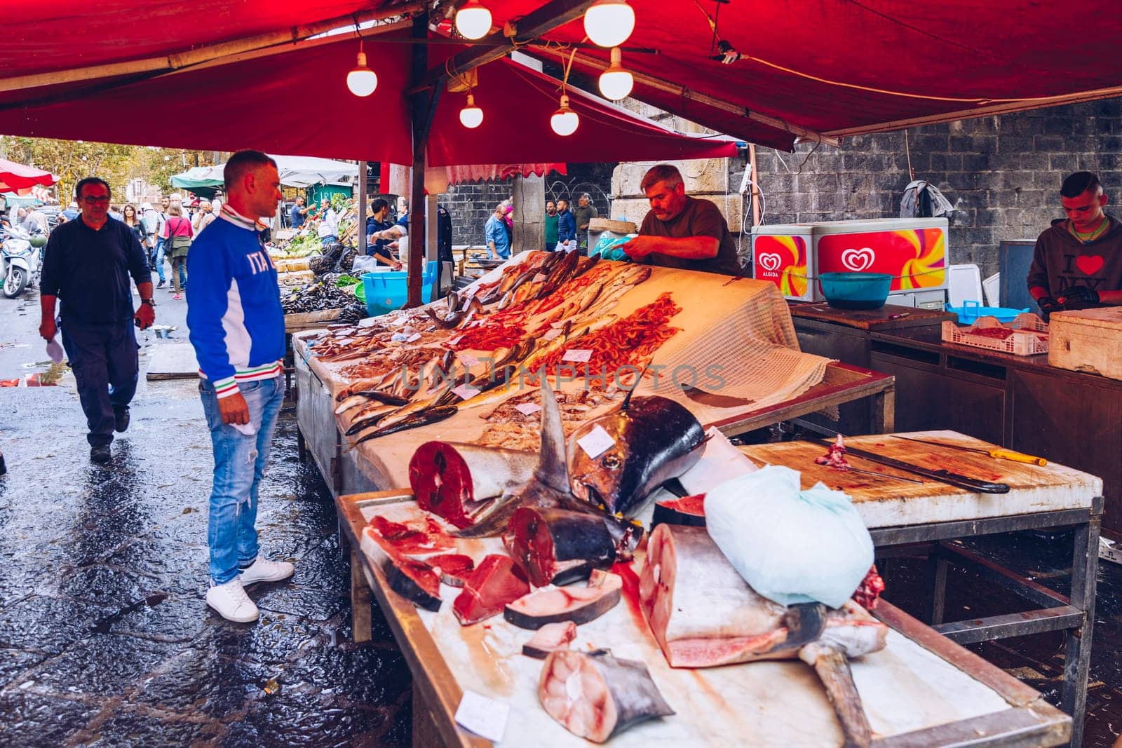 Catania, Italy - November 1, 2019: Seafood at fish market in Catania, Sicily, Italy. Fresh fish at the fish market in the old Town of Catania in the province of Sicily in Italy. 