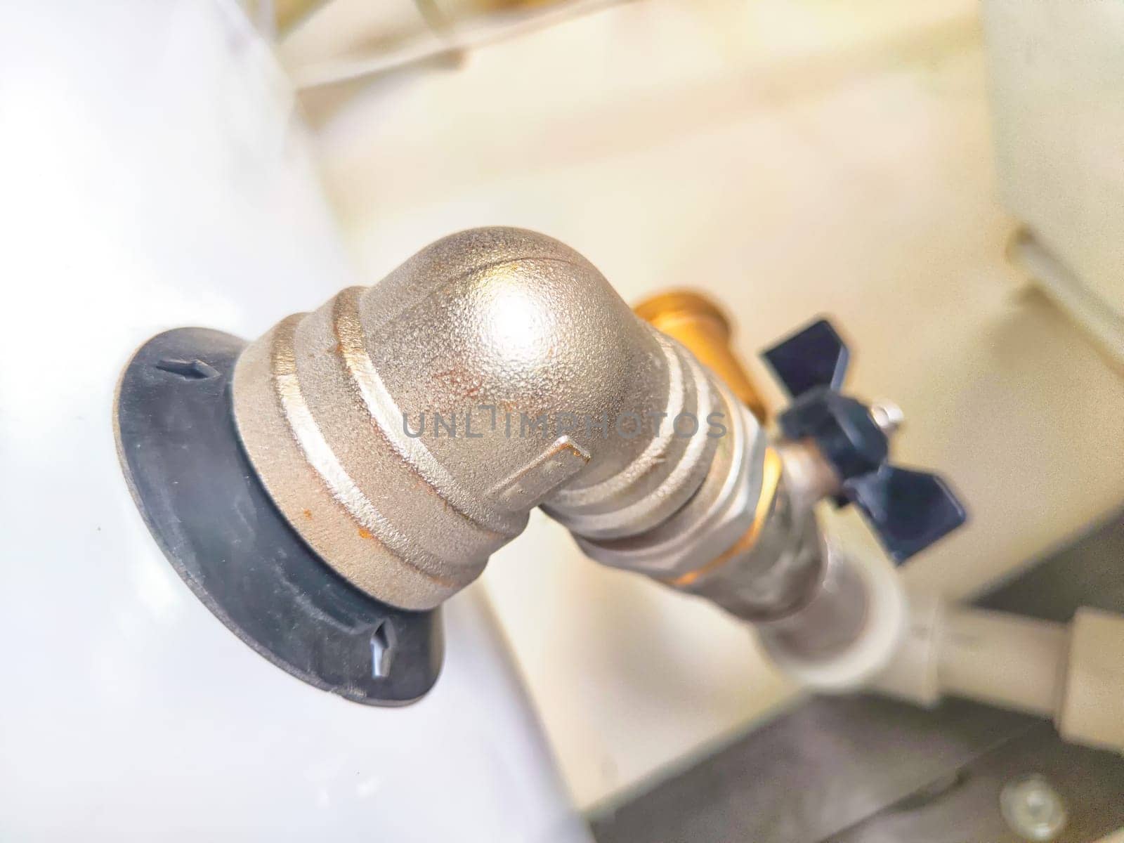 Close-Up of Domestic Water Shut-Off Valves. detailed view of the copper piping and two types of water shut-off valves typically installed in home plumbing system