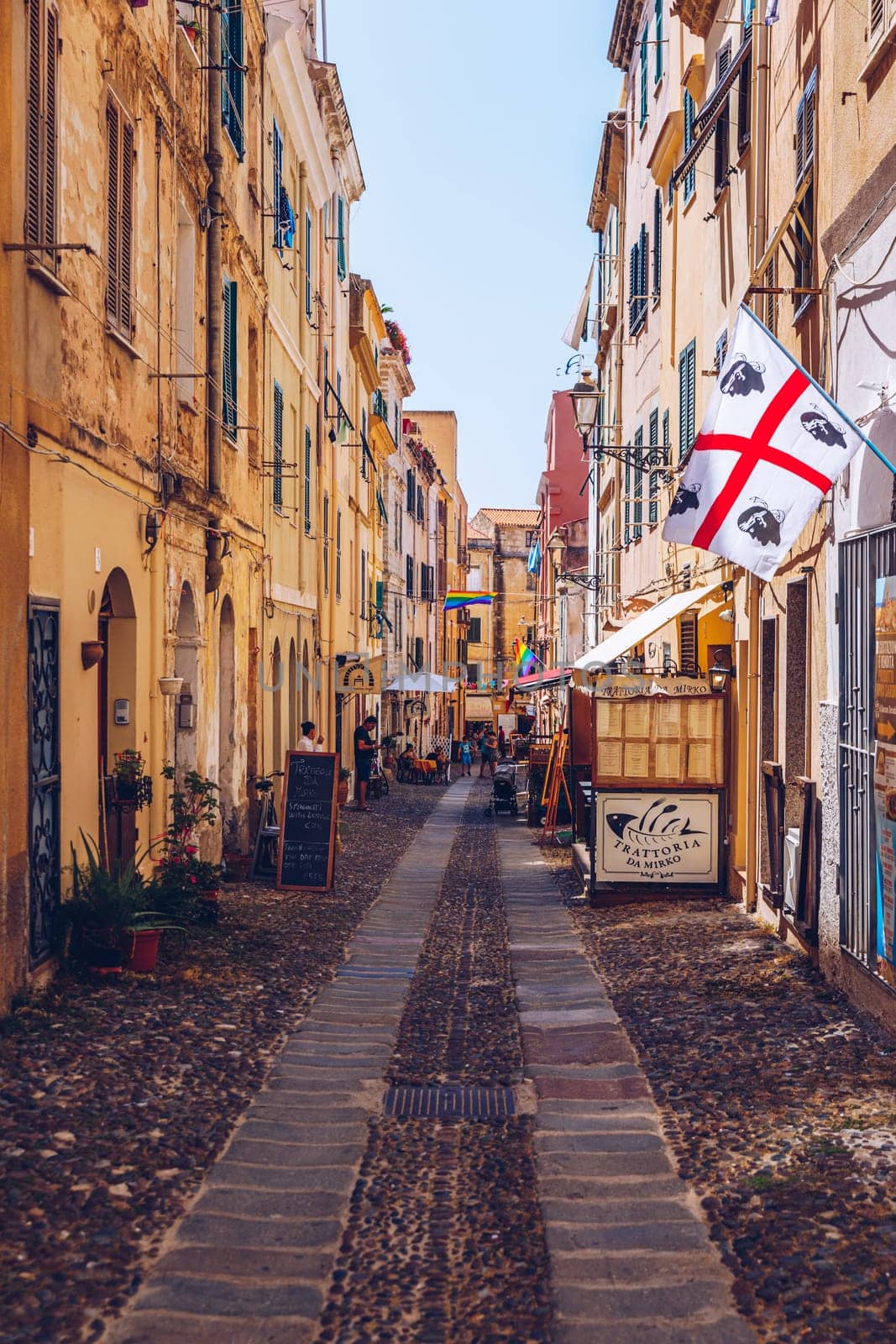 Alghero, Italy - July 21, 2019: Alghero old town, Alghero street view on a beautiful day. Alghero, Italy. Panoramic aerial view of Alghero, Sardinia, Italy. 