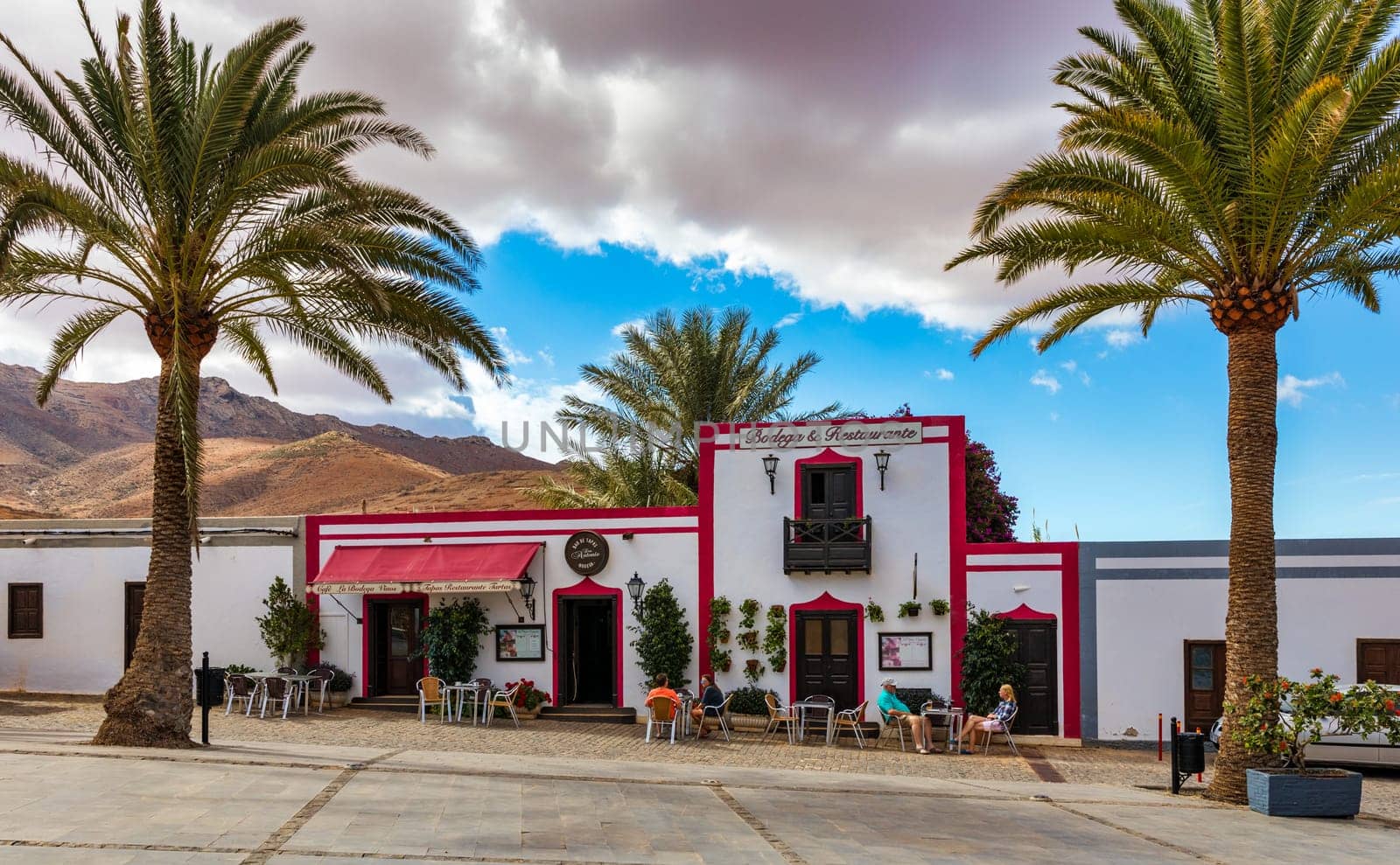 Betancuria, Fuerteventura - November 18, 2021: Cozy street with a typical house in the old town of Betancuria, Fuerteventura, Canary Islands, Spain. 
