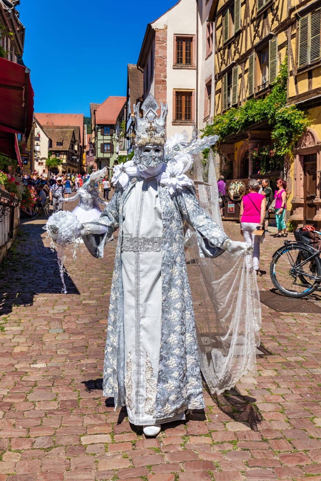 Riquewihr, France - 2 July 2022: Venetian Parade in Riquewihr. Most beautiful villages of France, Riquewihr in Alsace, famous "vine rote". Colorful town of Riquewihr, Alsace, France.