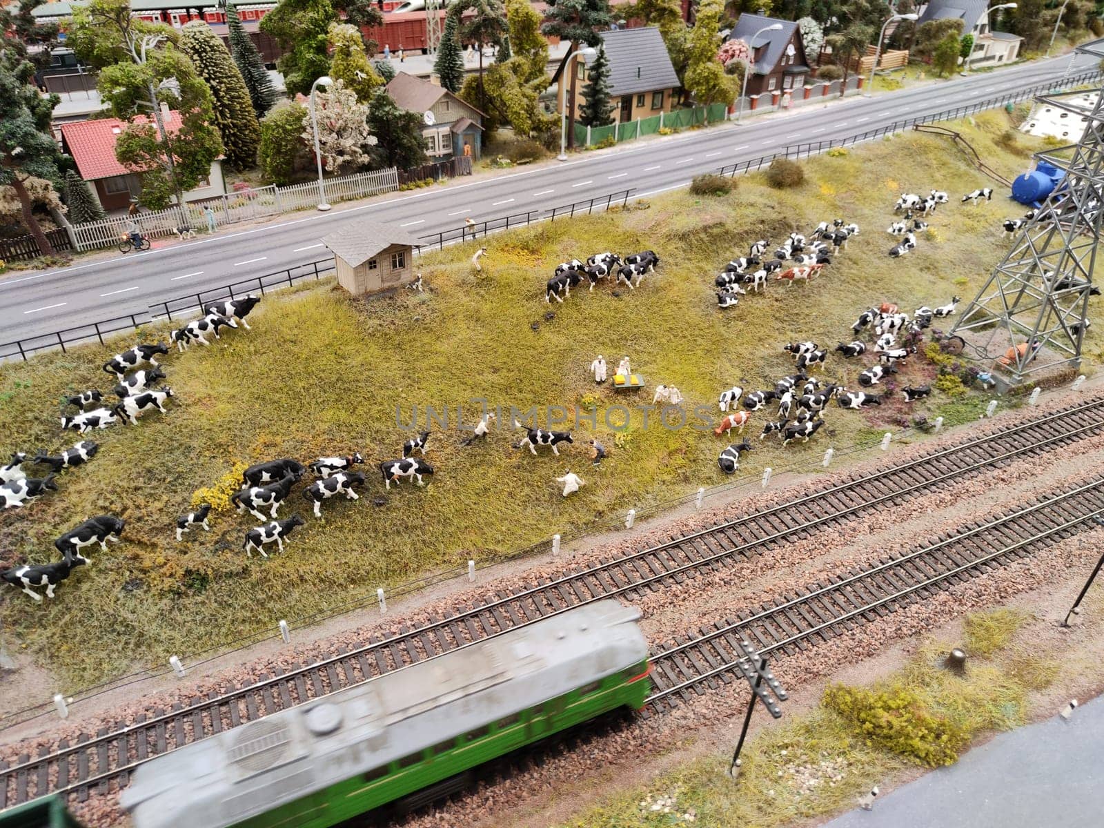 Saint-Petersburg, Russia - August 03, 2023: Grand project Russia. Layout of a city, country, street, landscape with small toy people, houses, roads, cars and nature