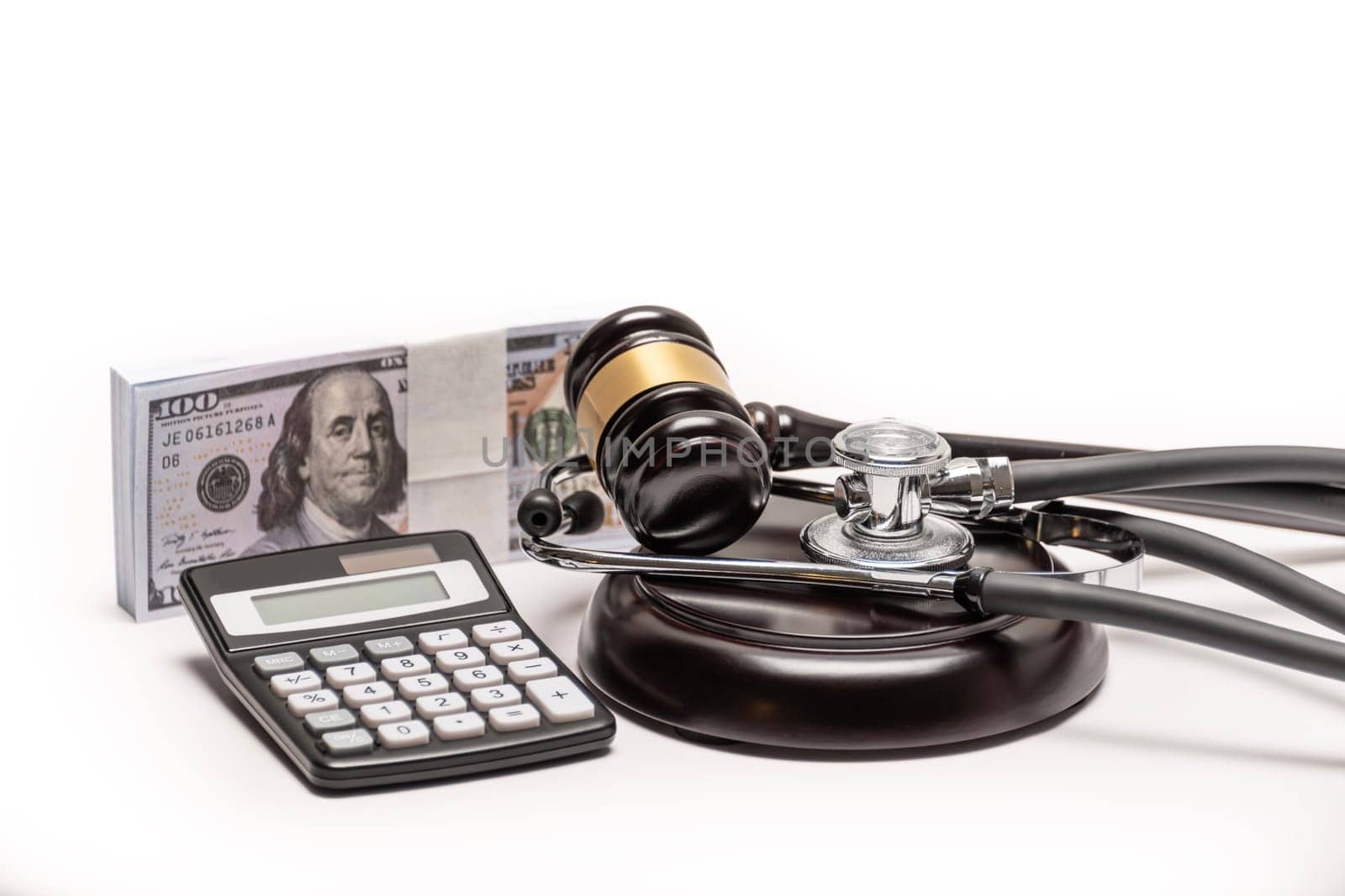A conceptual image featuring a gavel, cash, and stethoscope symbolizing medical malpractice litigation