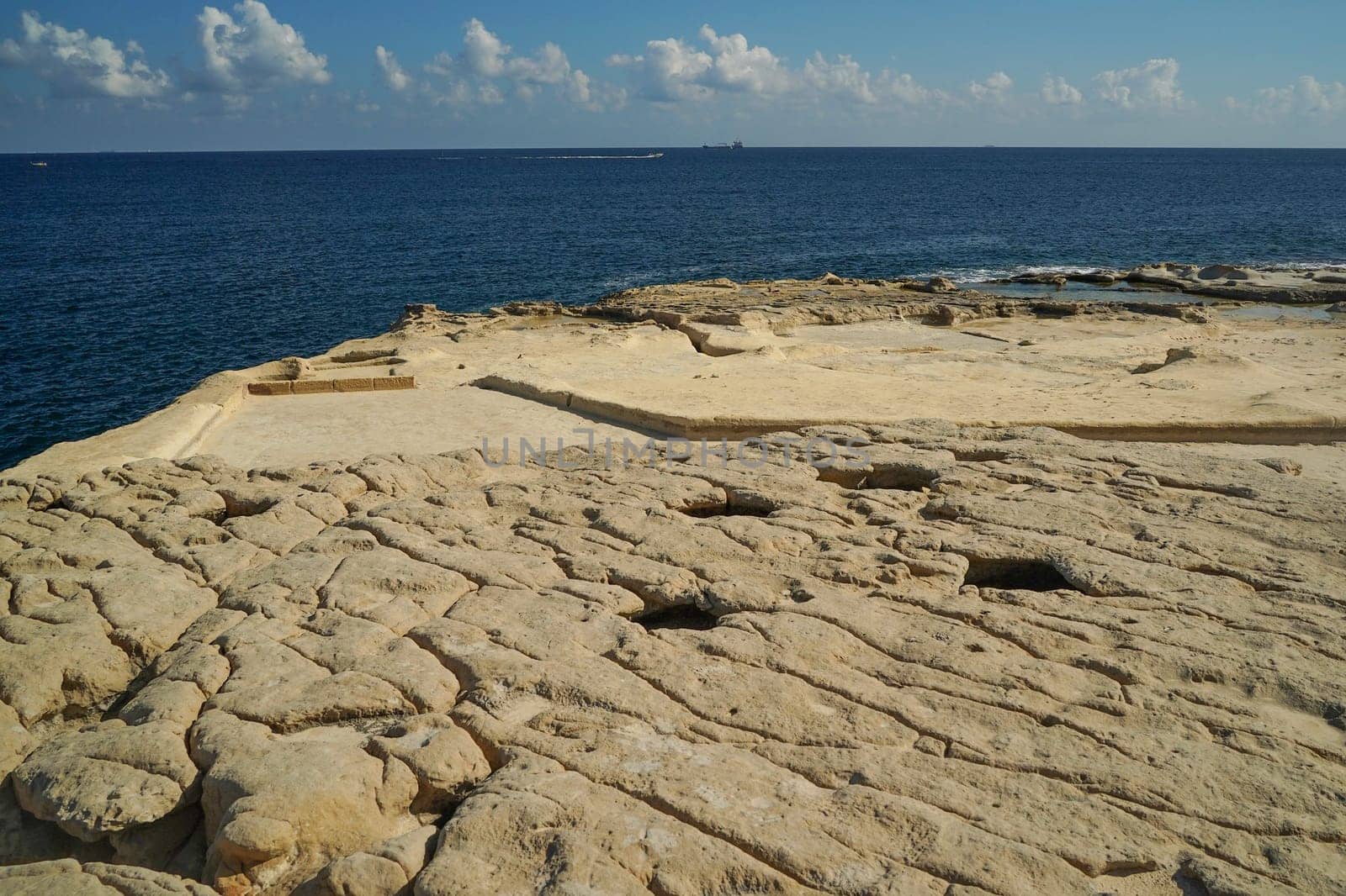 saint peter pools Malta rock formation hole on rocks by AndreaIzzotti