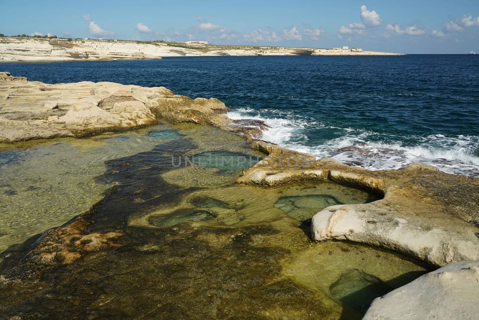 saint peter pools Malta rock formation hole on rocks by AndreaIzzotti