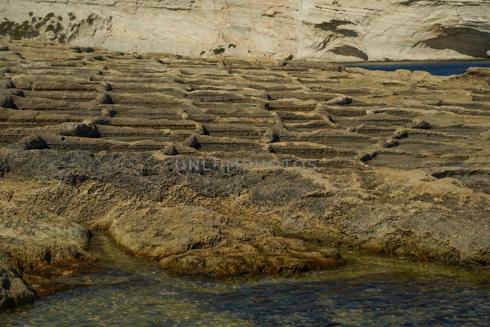 saint peter pools Malta rock formation hole on rocks by AndreaIzzotti