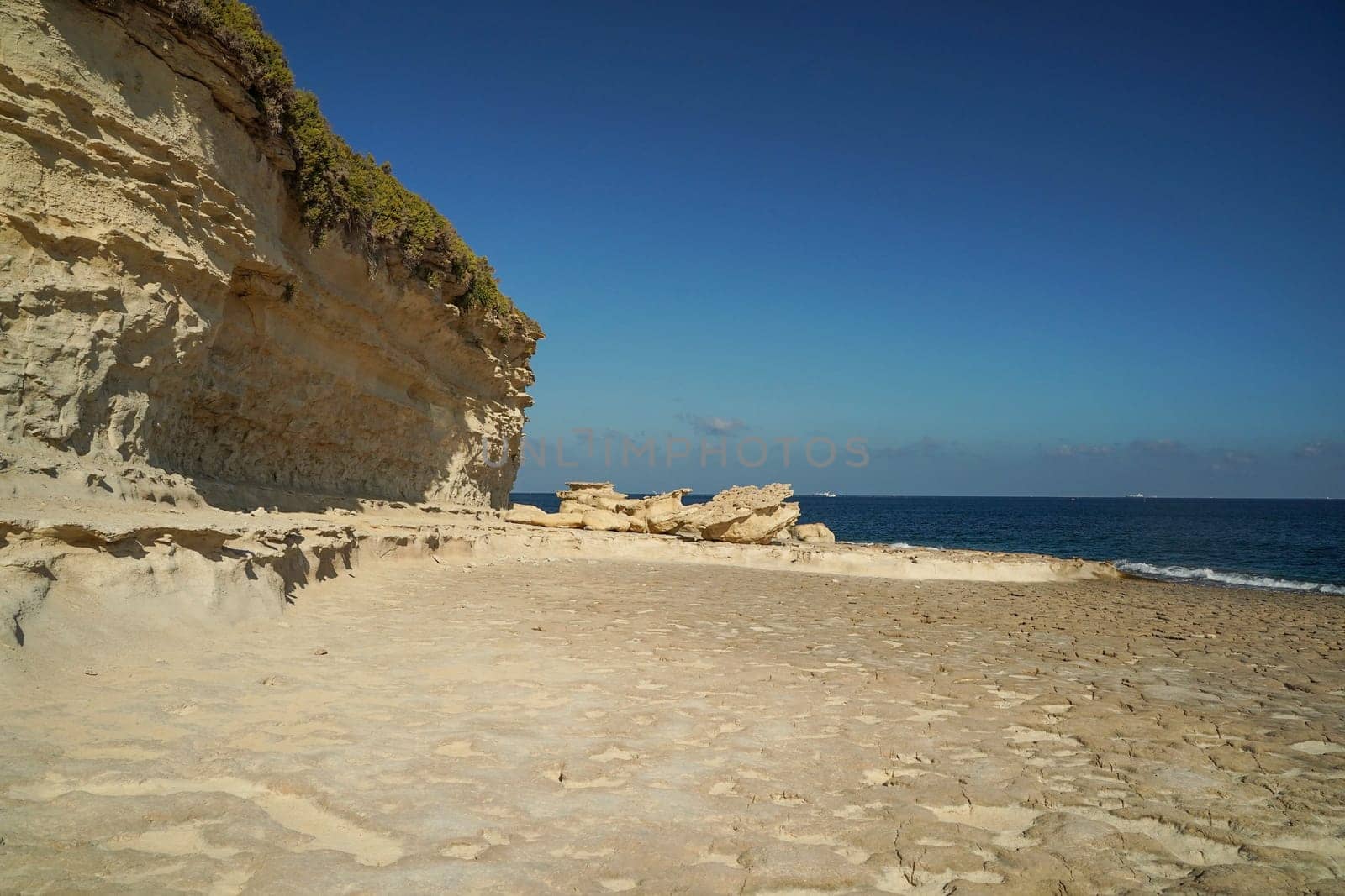 saint peter pools Malta rock formation hole on rocks by AndreaIzzotti