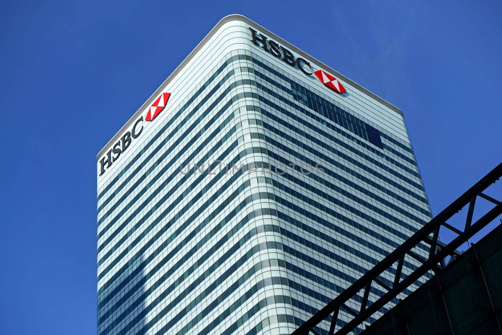 London, United Kingdom - February 03, 2019: Sun shines on world Headquarters of HSBC Holdings plc at 8 Canada Square, Canary Wharf. It is 7th largest bank worldwide, was established in 1865 by Ivanko