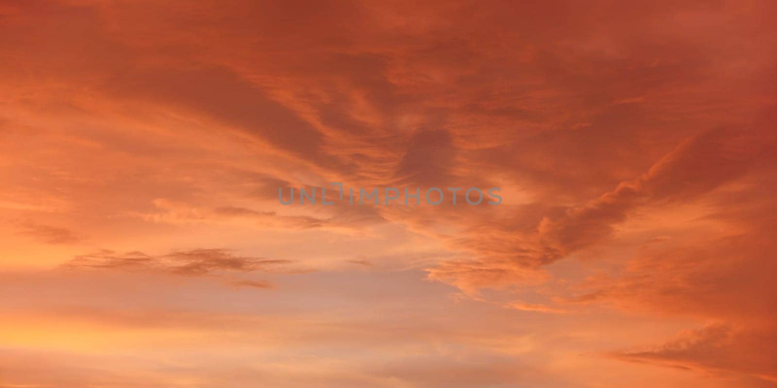 Orange and pink sky after sunset, nice clouds background by Ivanko