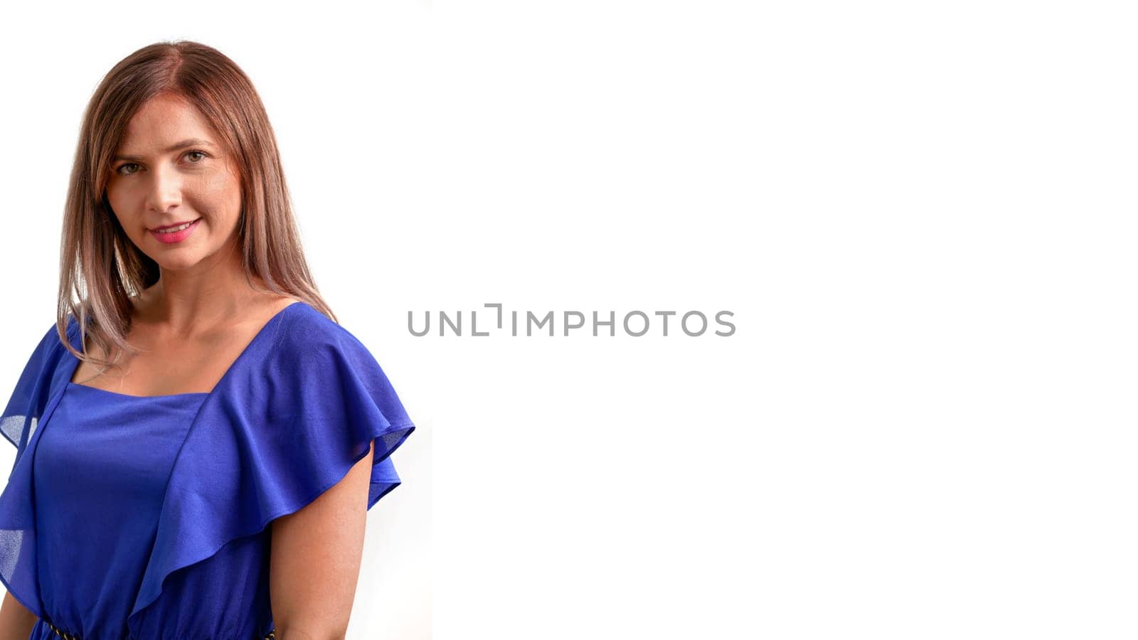 Waist up portrait of young woman in blue dress isolated on white background - space for text right side by Ivanko