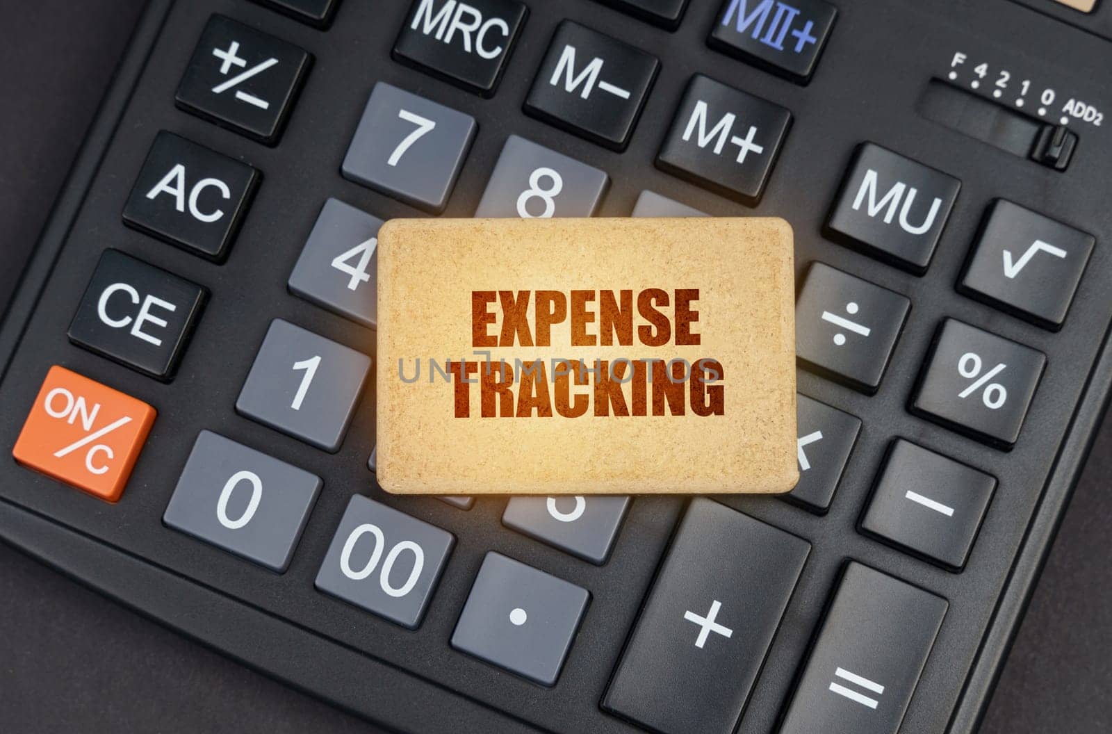 Financial concept. There is a sign on the calculator that says - Expense tracking