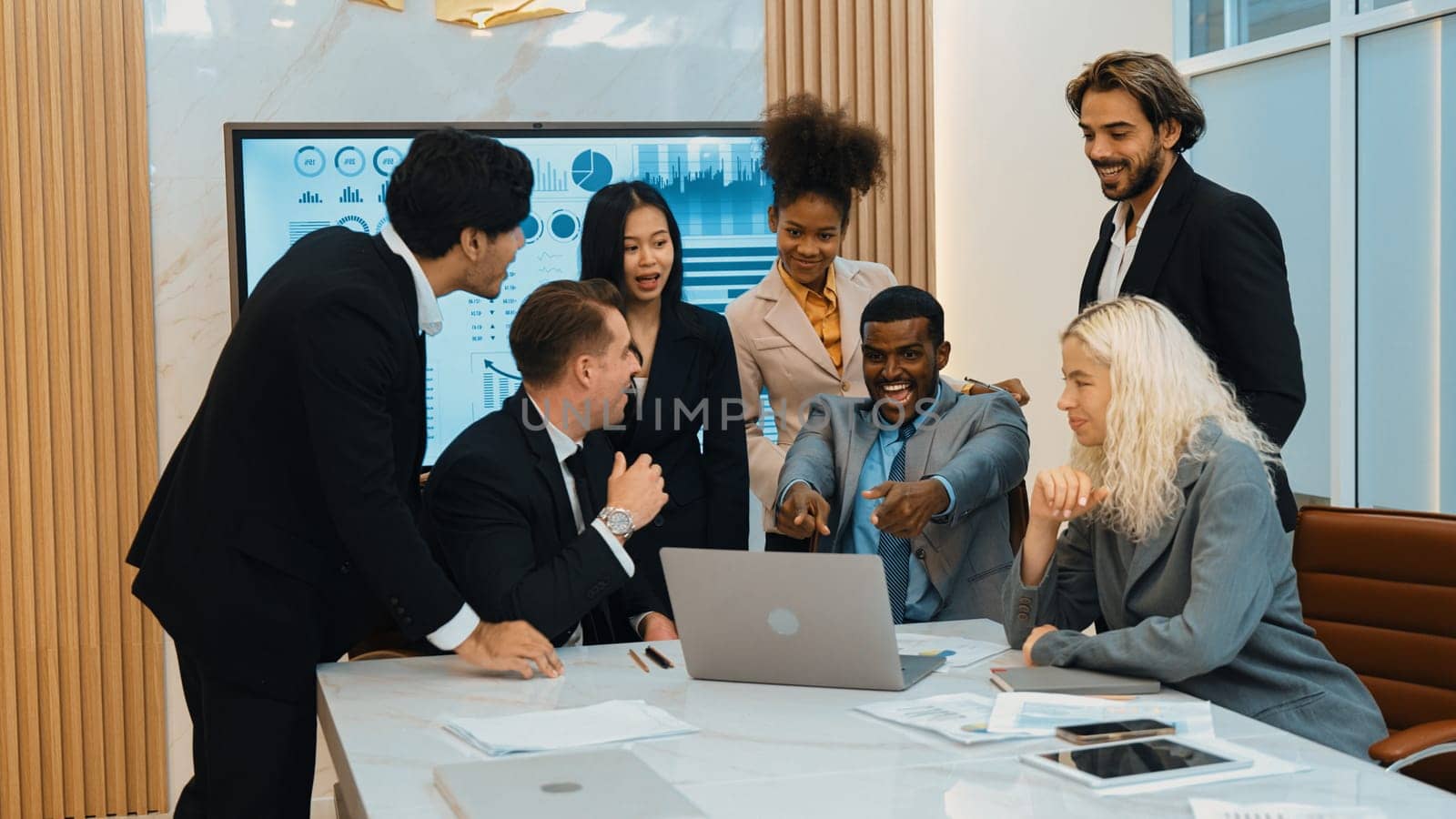 Diverse group of office worker and employee applauding, happy collaborate on strategic business marketing planning. Teamwork and positive attitude create productive and supportive in ornamented office