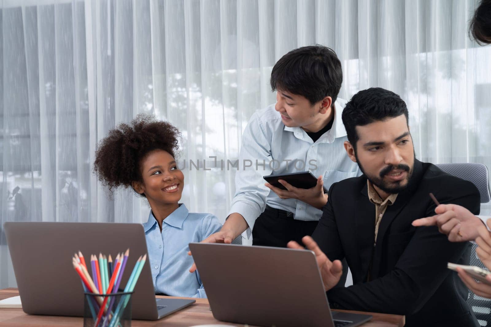 Modern multicultural office worker in corporate workplace. Concord by biancoblue