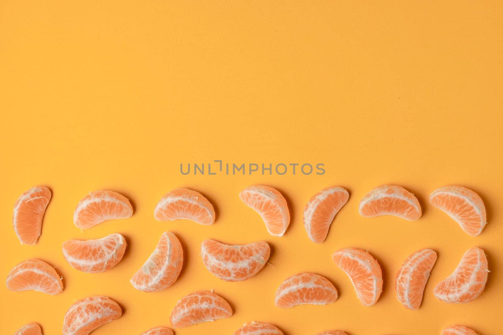 Collection of tangerine lobules, citrus food background with copy space