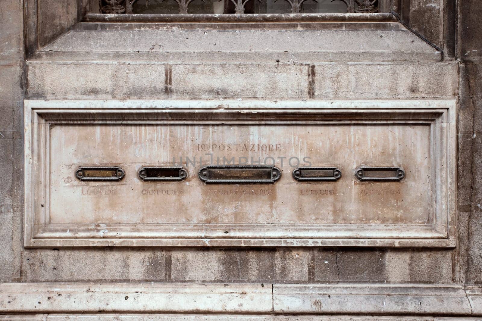 Traditional rustic letterboxes, stone letterboxes in the wall by mailos