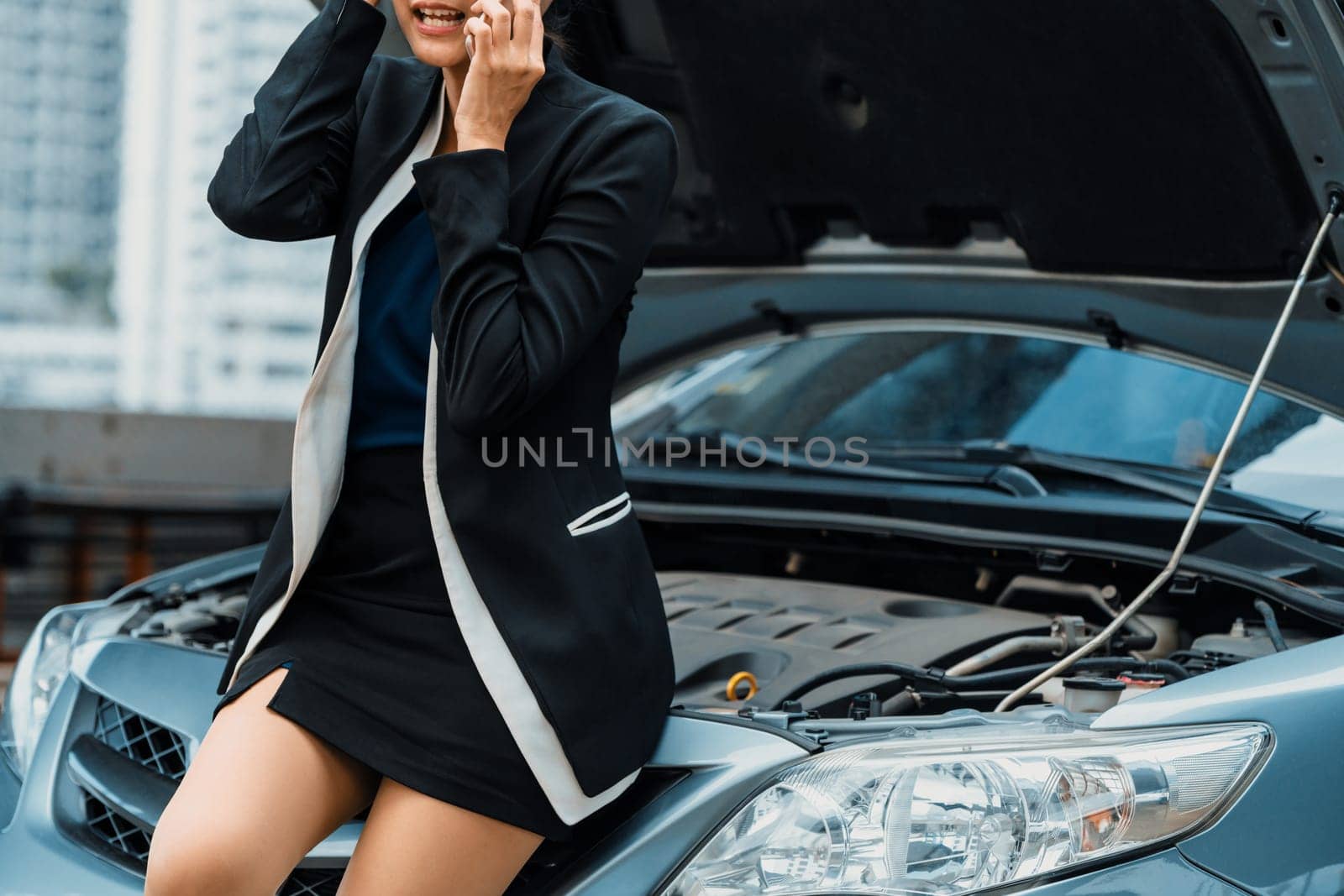 Woman whose car breakdown call for repair service. uds by biancoblue