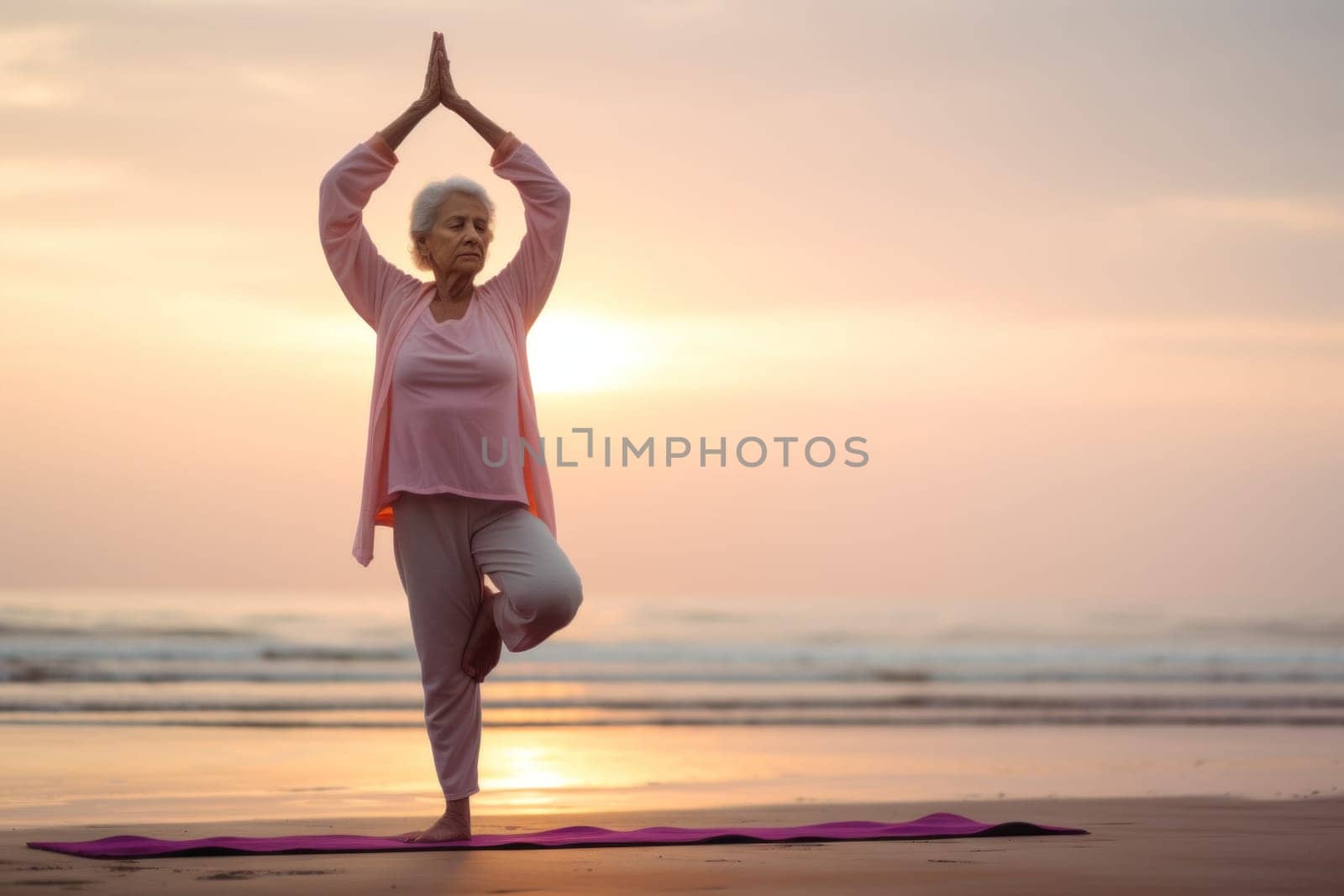 Senior woman practicing yoga and meditation on the beach .Generative AI.