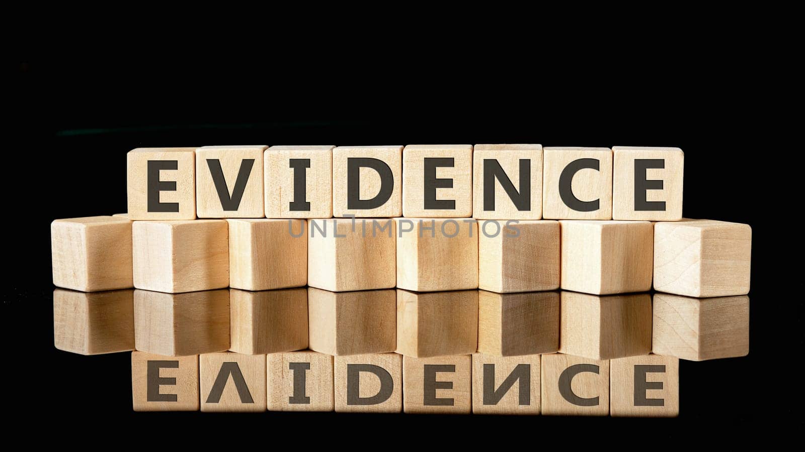 EVIDENCE text assembled from wooden cubes on a black background