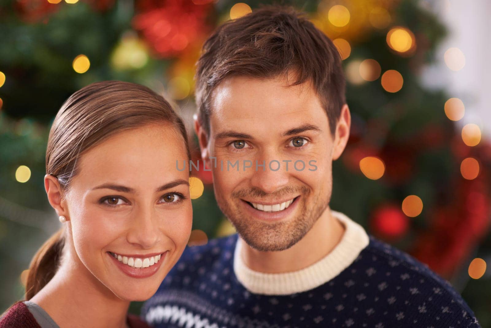 Portrait, Christmas and couple with love, smile and party with romance and home with lights. Face, apartment and man with woman and celebration with holiday and festive season with marriage and Xmas.