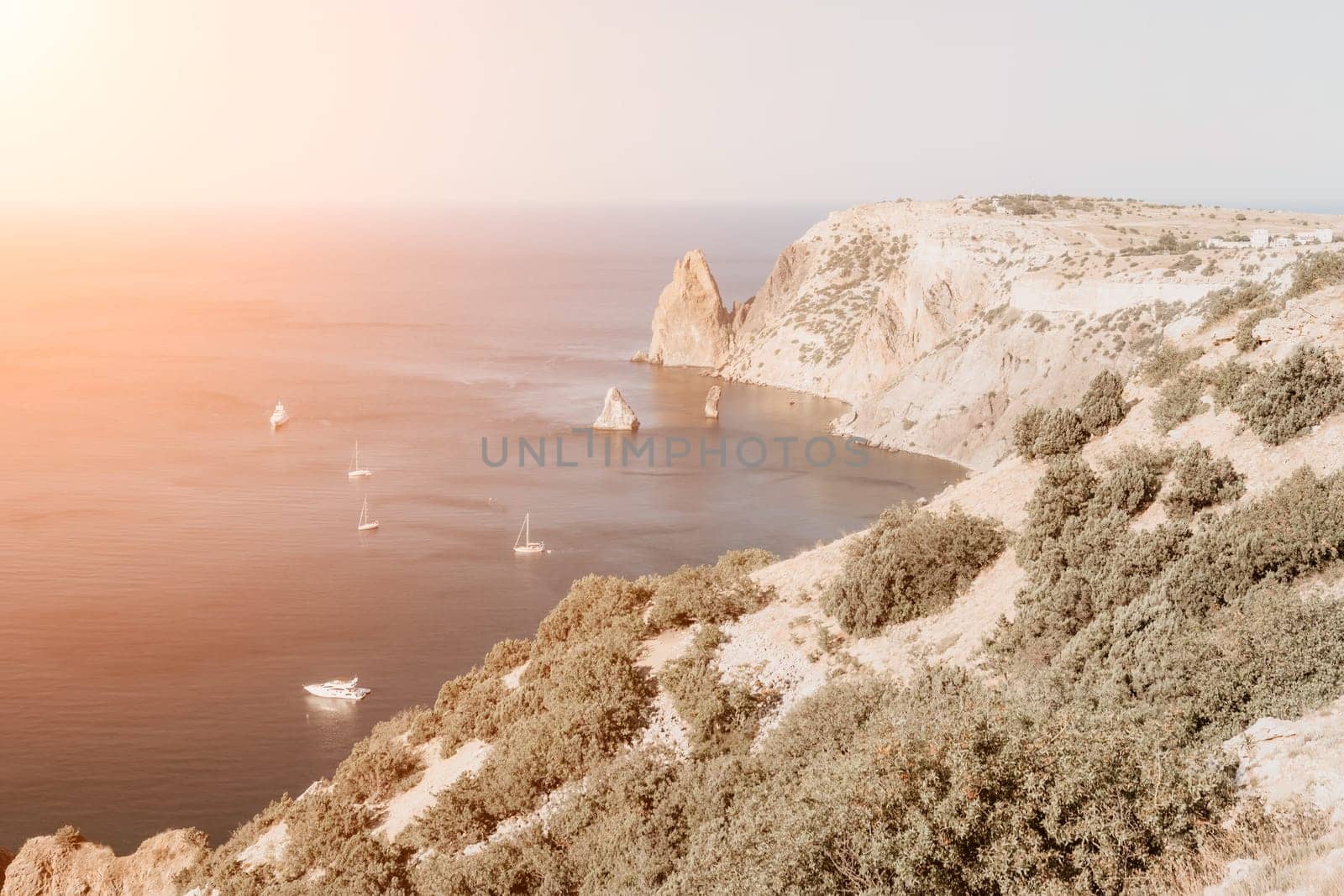 Aerial panoramic view of beautiful sunset above sea. Beautiful seascape. Sun glare, small waves on the water surface. Evening. Horizon. Nobody. No people. Copy space. Never-ending beauty of nature