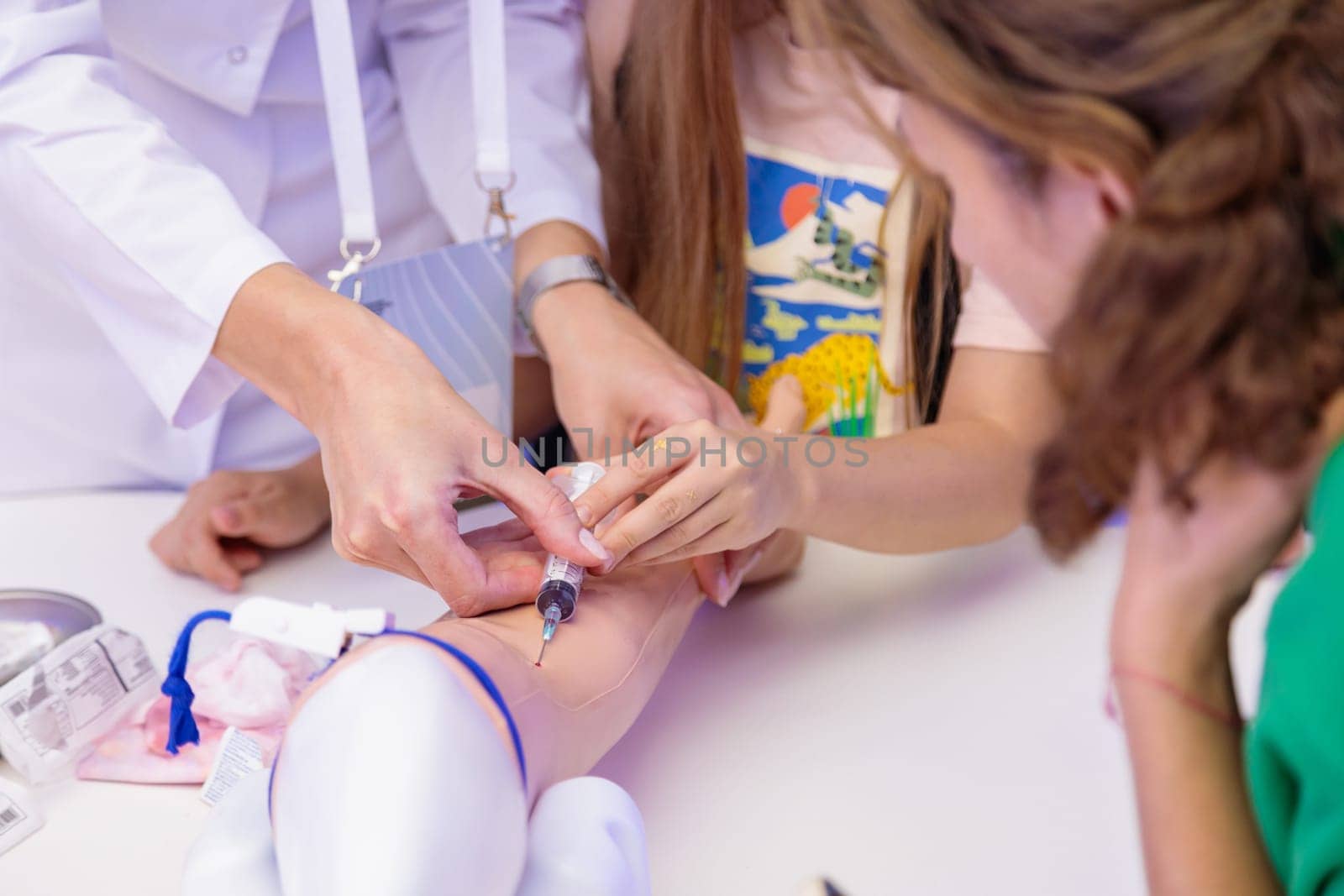 Training of blood sampling from a vein, on a model of a human hand. Moscow Russia August 19, 2023.