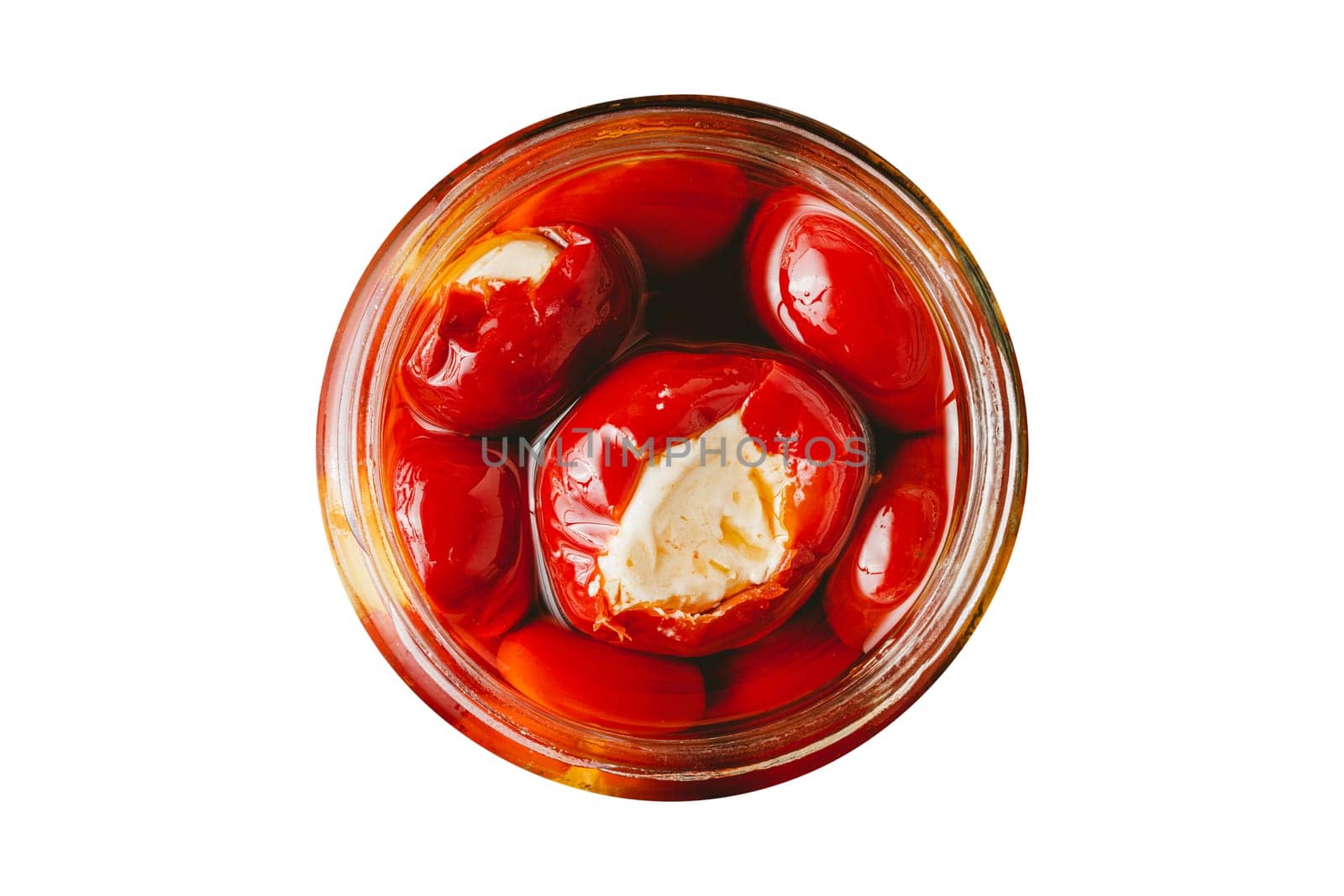 Stuffed cherry peppers with ricotta cheese filling in glass jar on white background by Sonat