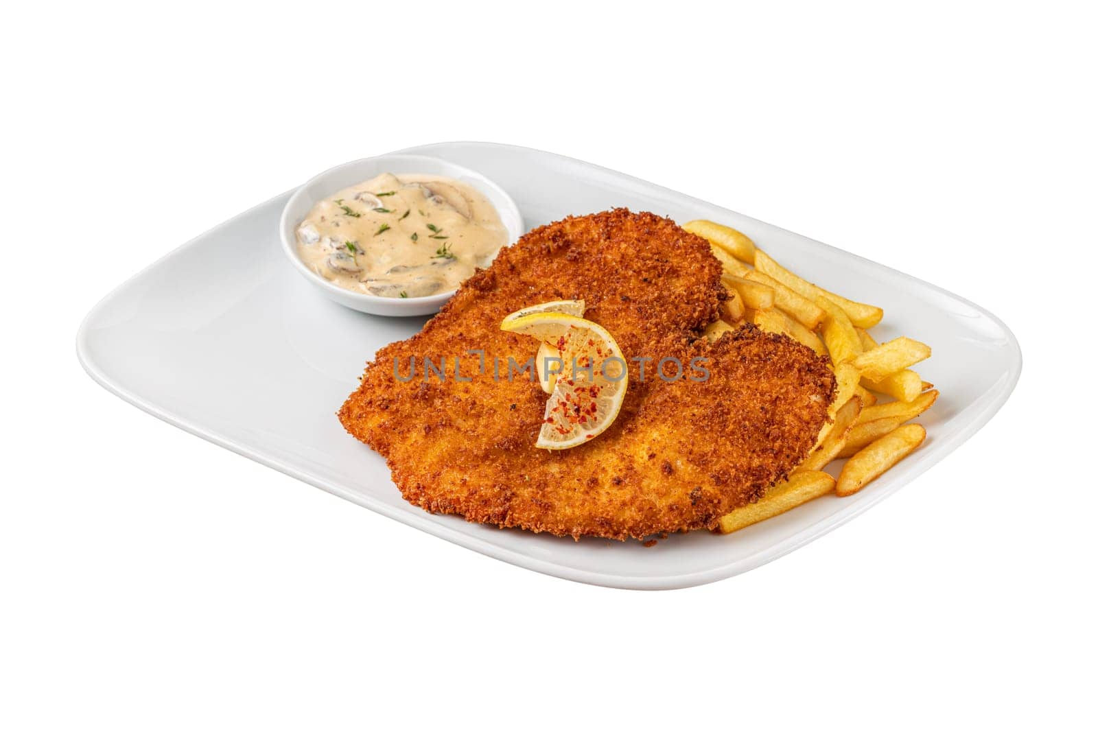 Chicken schnitzel with butter and potato salad on white porcelain plate by Sonat