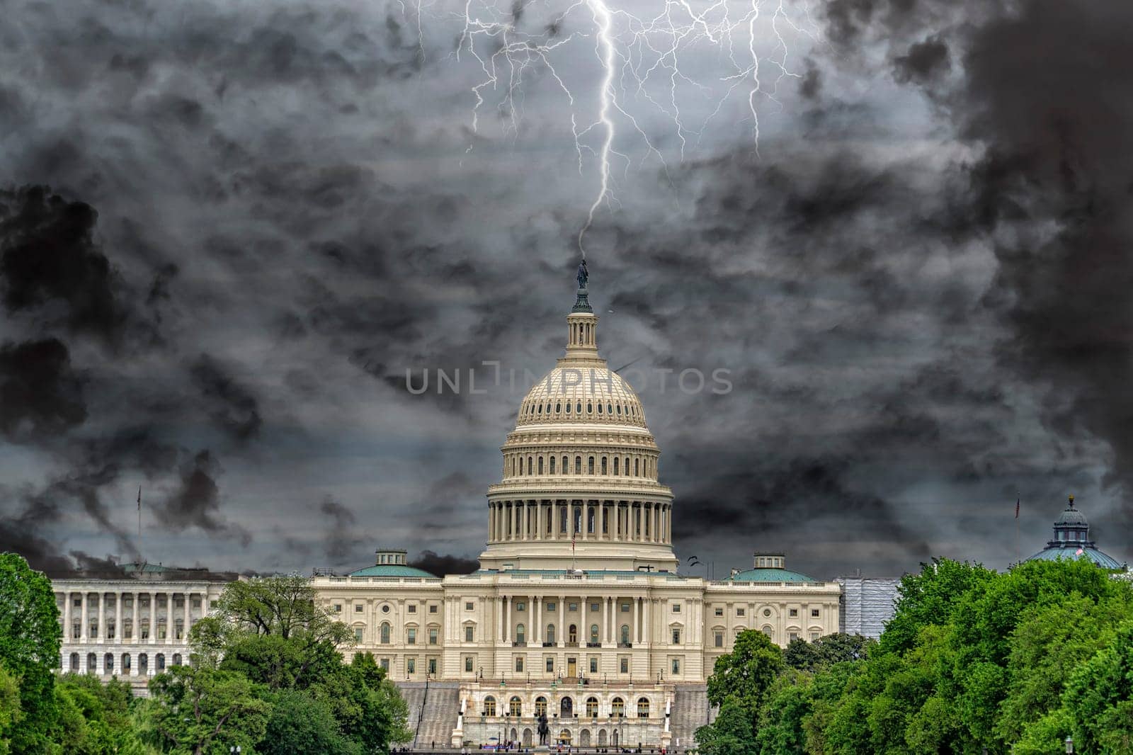 Washington DC Capitol from the mall on cloudy sky background by AndreaIzzotti