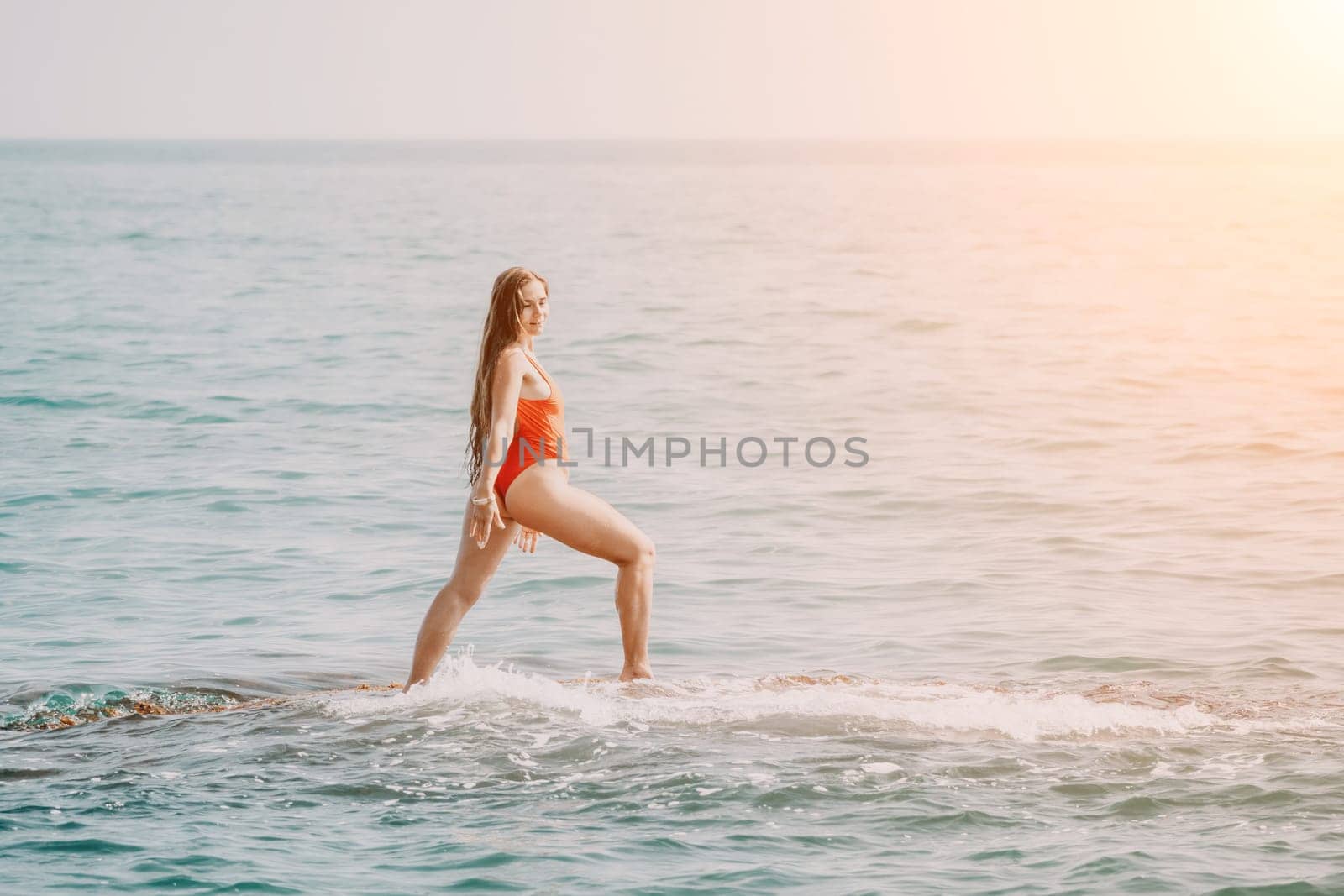 Woman sea yoga. Happy woman meditating in yoga pose on the beach, ocean and rock mountains. Motivation and inspirational fit and exercising. Healthy lifestyle outdoors in nature, fitness concept. by panophotograph