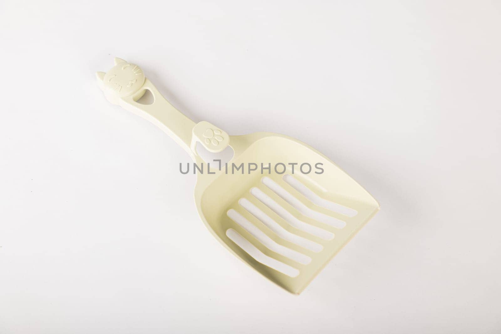 Maintain the purity of your cat's litter box with isolated metal cat litter scoops on a white background. It's all about care hygiene and cleanliness for your feline friend. by Sorapop