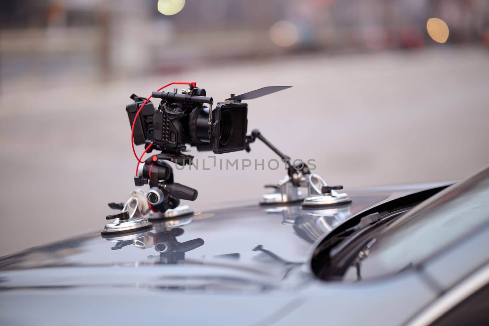 A professional camera rig is mounted on a vehicle, ready for filming cinematic projects and advertisements on the go by dotshock