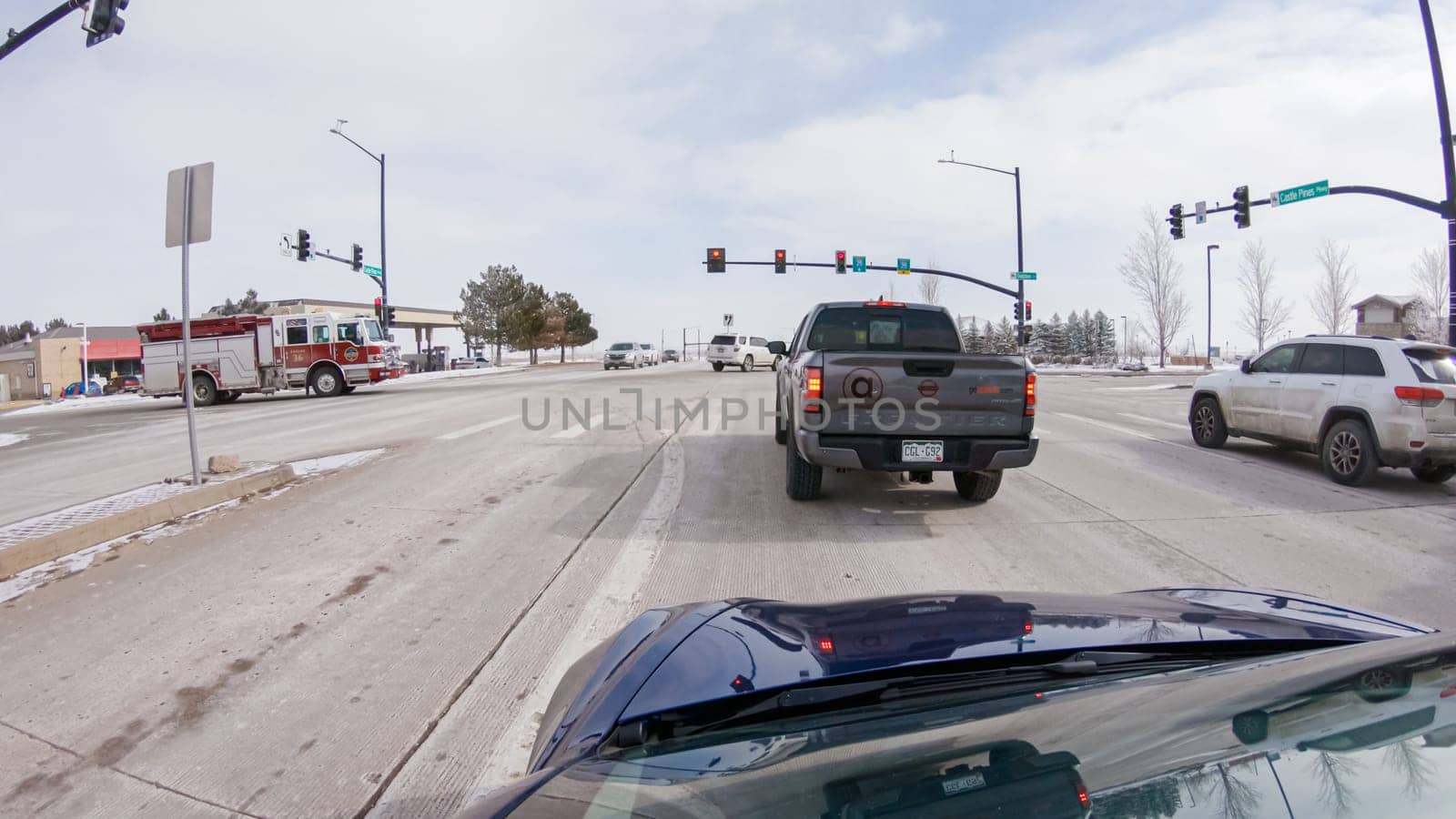 Driving on Suburban Road Post-Winter Storm by arinahabich