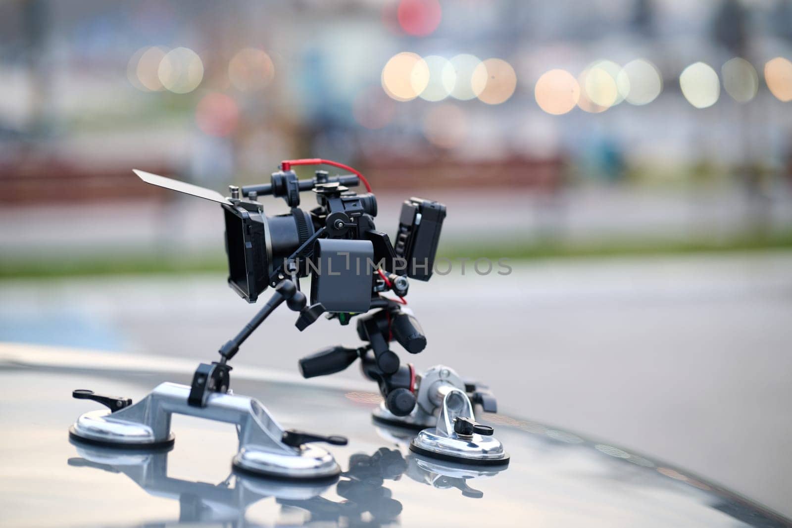 A professional camera rig is mounted on a vehicle, ready for filming cinematic projects and advertisements on the go.