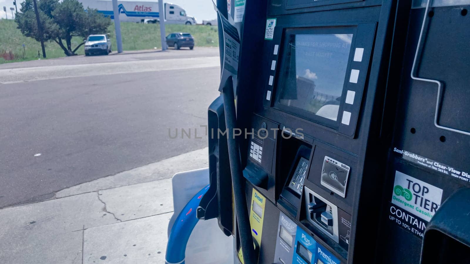 Denver, Colorado, USA-July 7, 2021-In the heart of rural America, a white truck is being refueled at a local gas station.