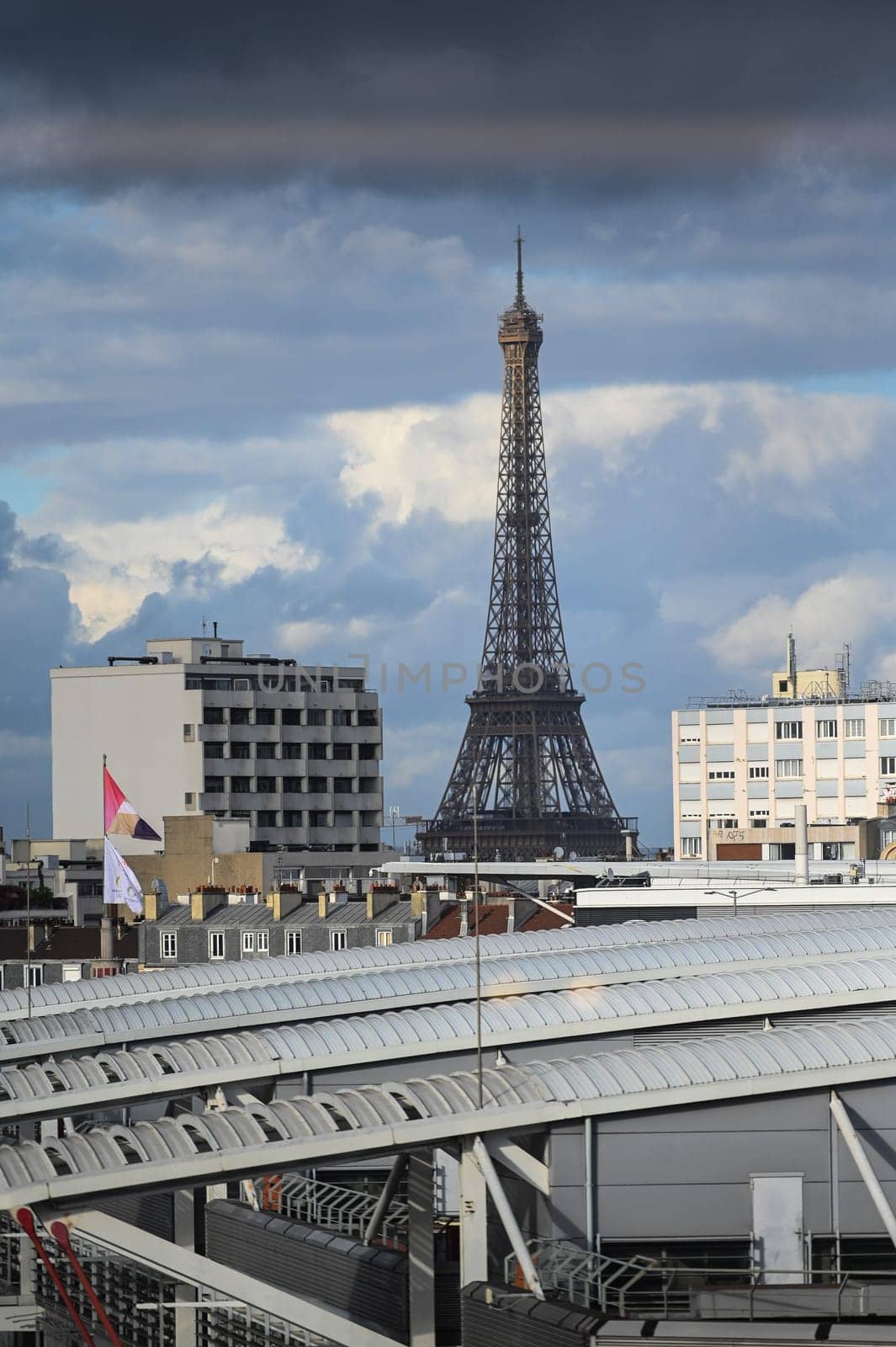 View of the Eiffel Tower from the roofs of the buildings towards Porte de Versailles by FreeProd