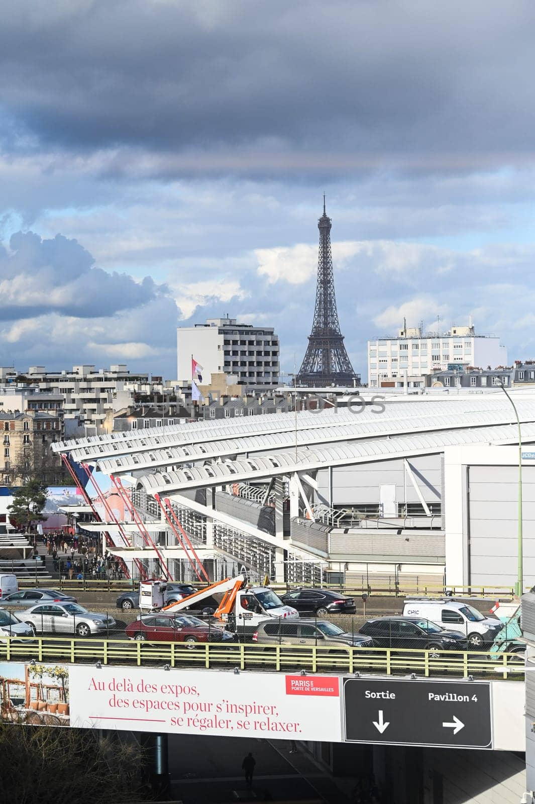 View of the Eiffel Tower from the roofs of the buildings towards Porte de Versailles, High quality photo