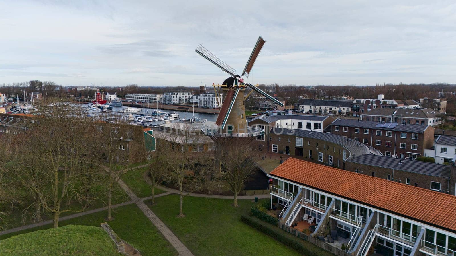 drone aerial photo of windmill de goede hoop in holland village Hellevoetsluis with a part of the harbor in the background