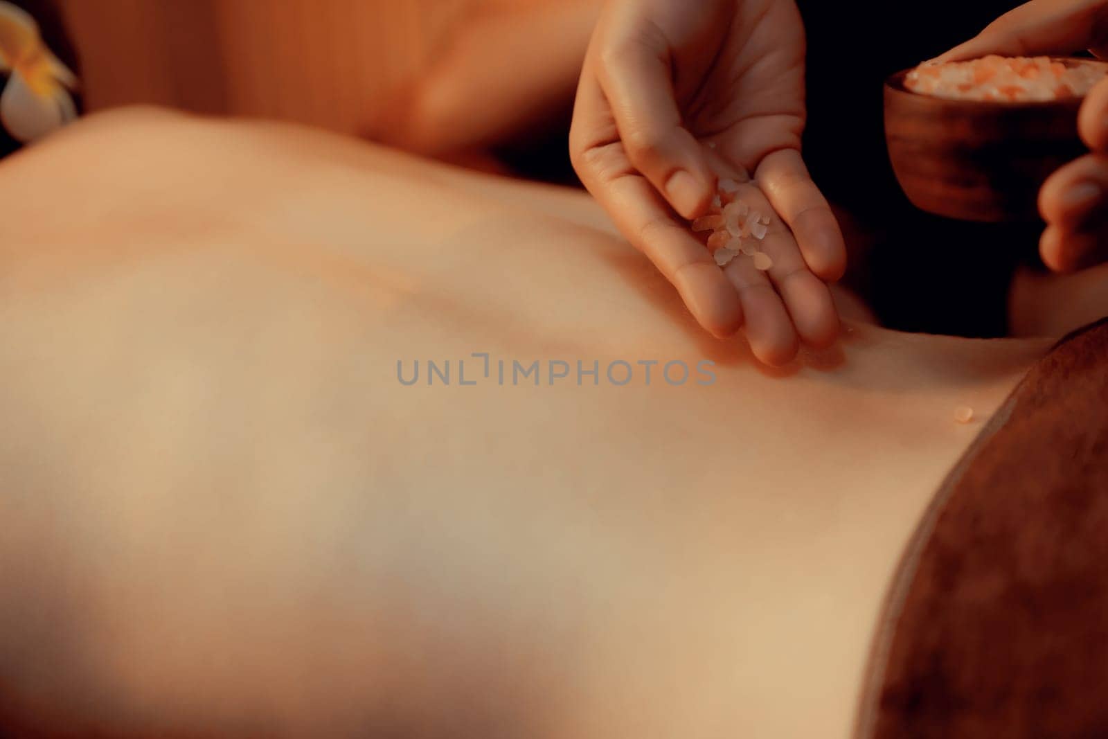 Closeup woman customer having exfoliation treatment in luxury spa. Quiescent by biancoblue