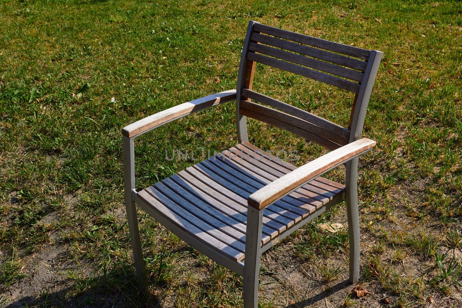 rack-and-pinion chair on a background of green grass. by electrovenik