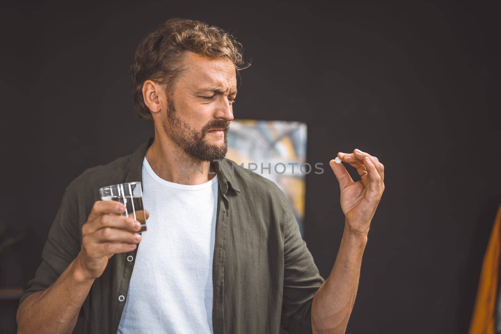 Man Holding Cigarette pill or medicine by LipikStockMedia