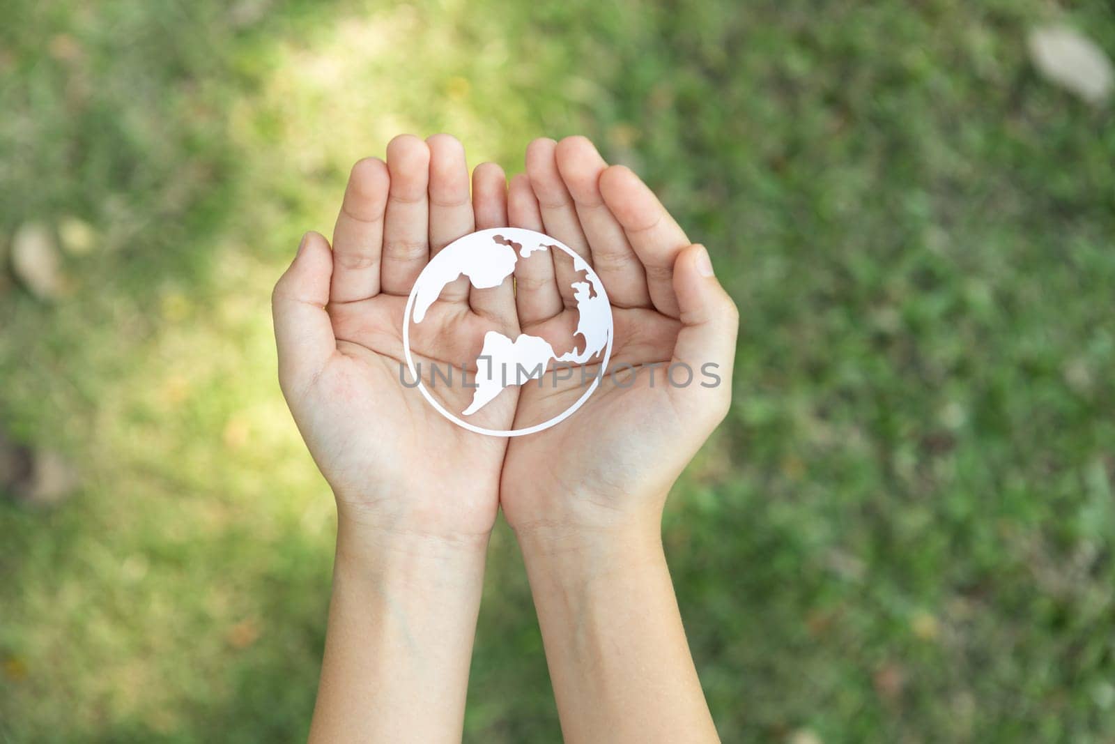 Top view hand holding Earth planet icon symbolize eco-friendly commitment. Gyre by biancoblue
