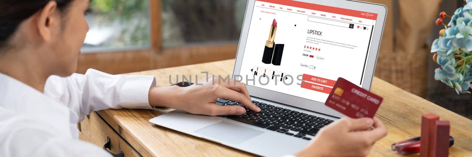 Woman shopping online on internet marketplace browsing for uttermost sale items by biancoblue