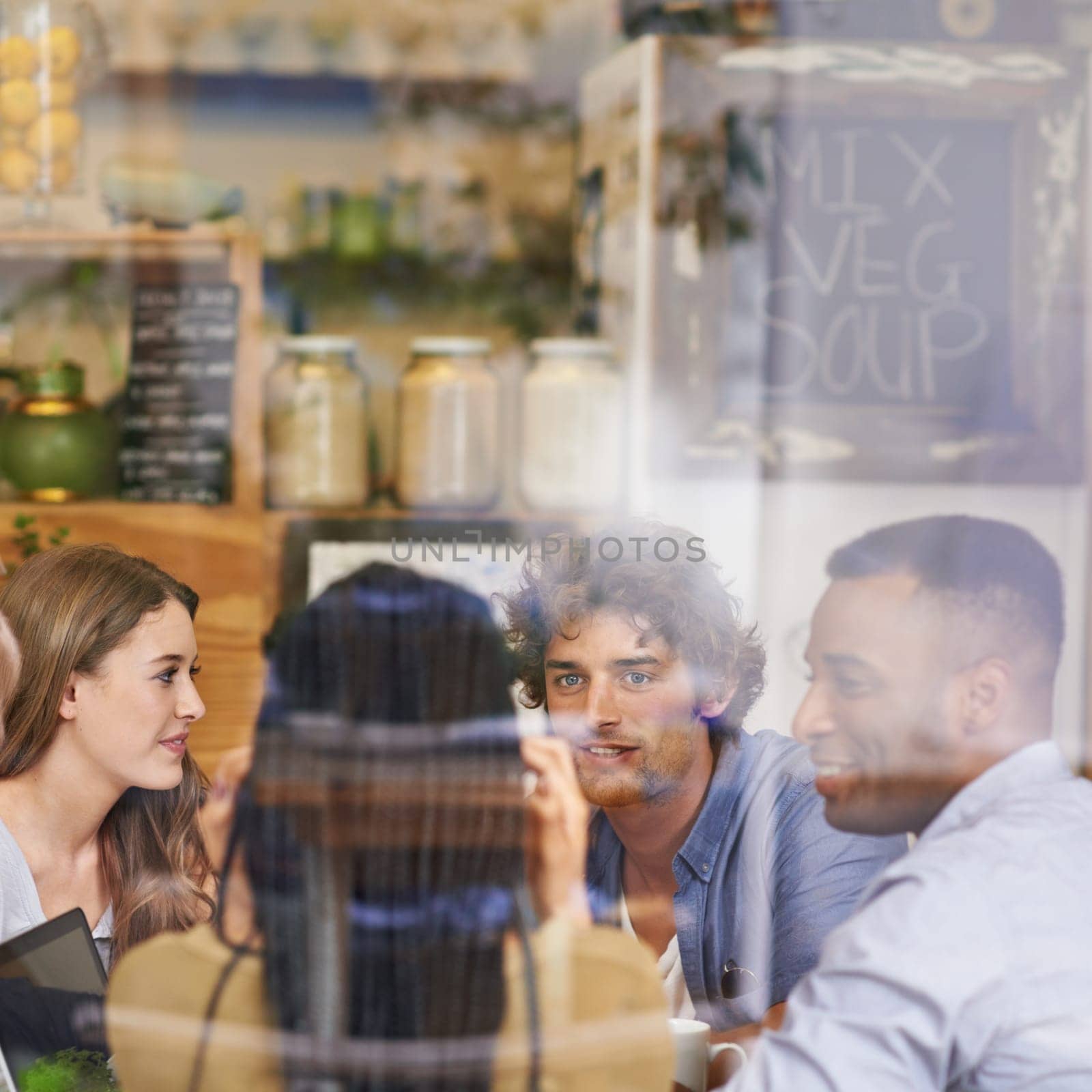 Conversation, window and friends in restaurant with diversity, bonding and social gathering for lunch. Coffee shop, brunch and group of people relax in cafe for casual chat, drinks and happy talking. by YuriArcurs