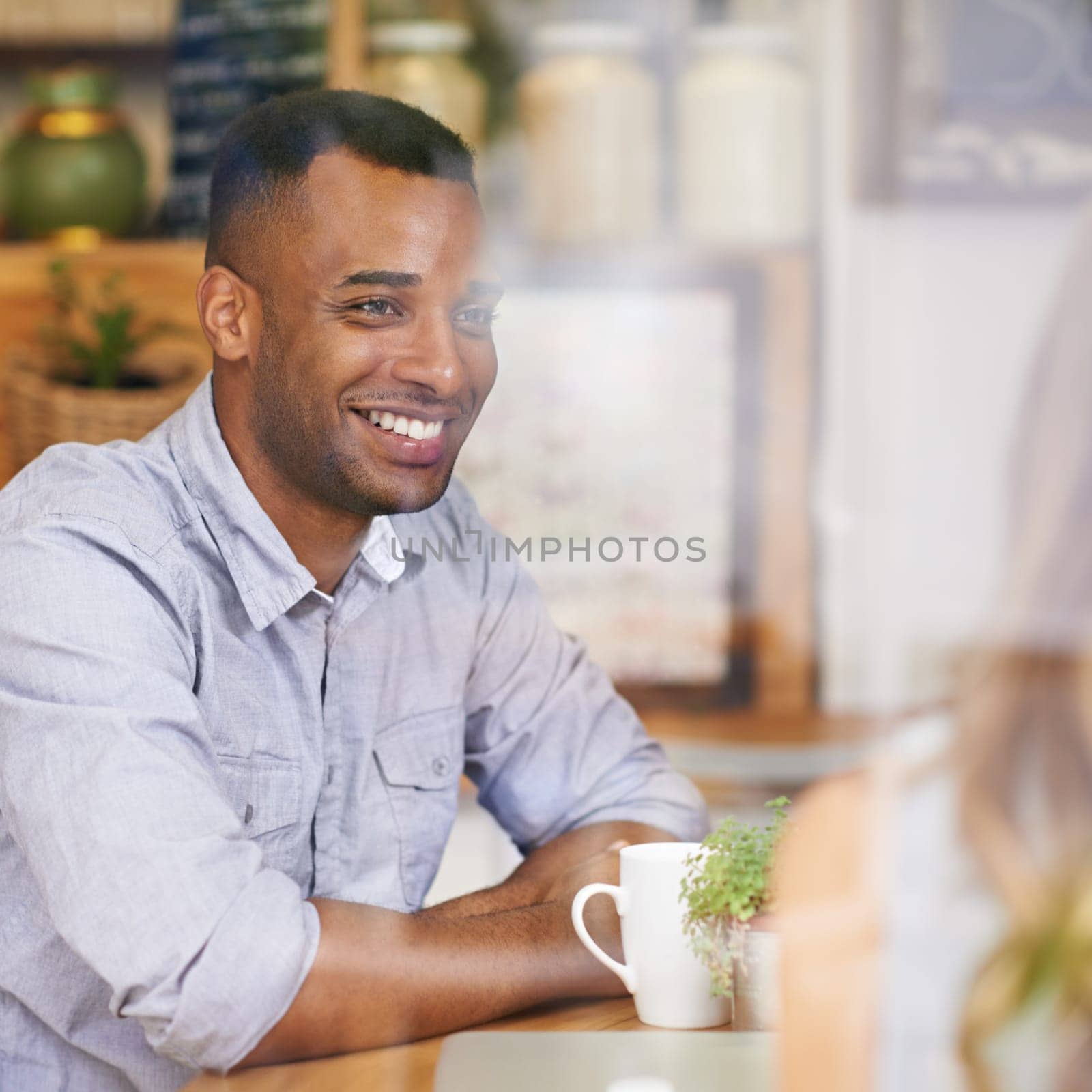 Coffee, black man and thinking in cafe with woman for date, vacation or morning drink on holiday. Smile, male person and happy in restaurant with girlfriend for bonding, love or break together.