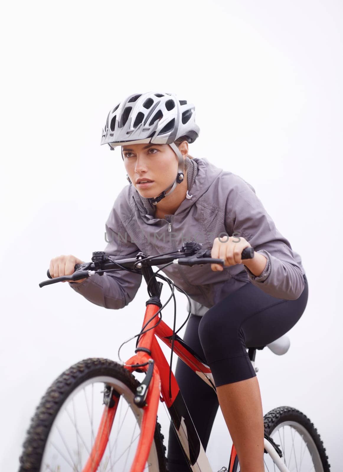 Athlete, bike and nature with ride, speed and fitness for health and wellness or workout. Woman, cycling and exercise for training, transportation and adventure with helmet and cardio or perseverance by YuriArcurs