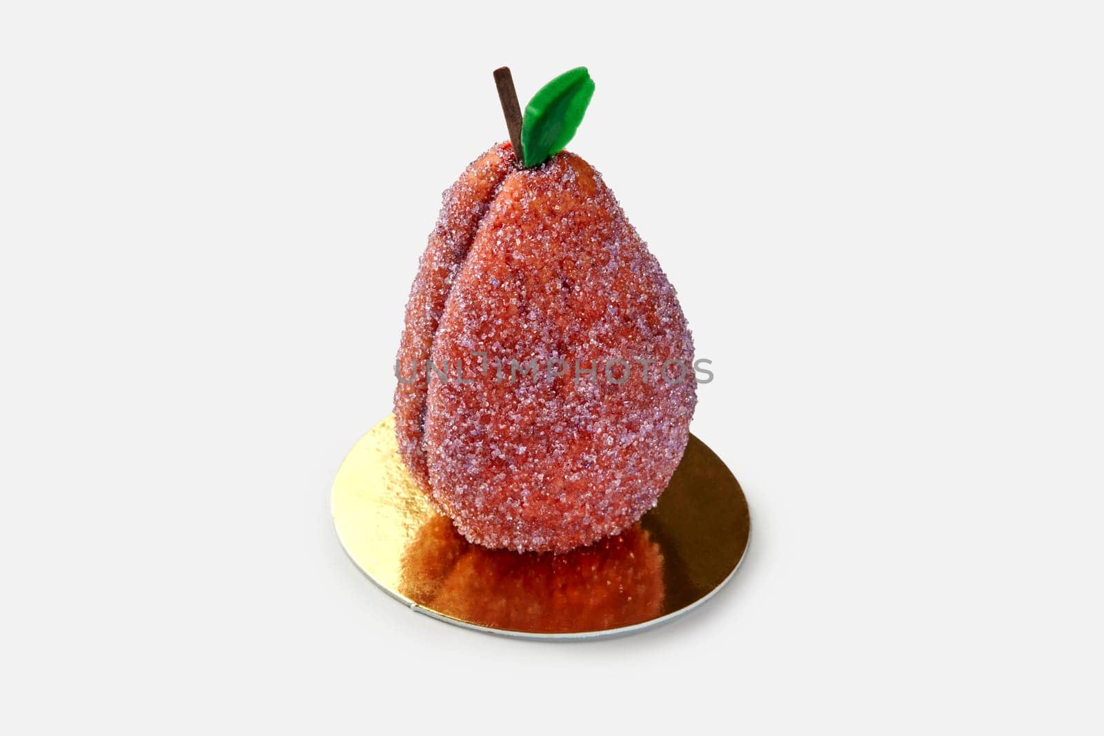 Appetizing colorful plum-shaped pastry from shortcrust dough, generously sprinkled with sugar and filled with fruit curd, presented on golden serving cardboard