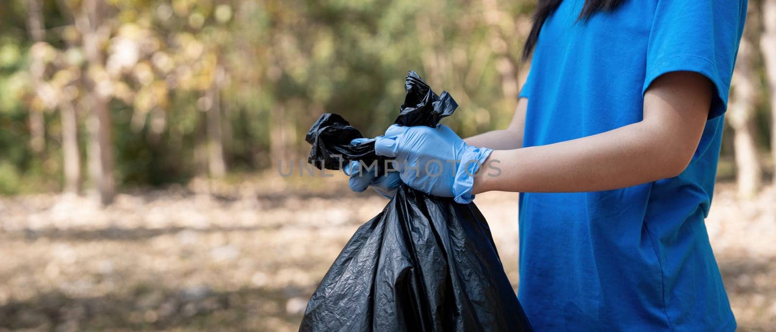 Separating waste to freshen the problem of environmental pollution and global warming, plastic waste, care for nature. Volunteer concept carrying garbage bags collecting the garbage by nateemee
